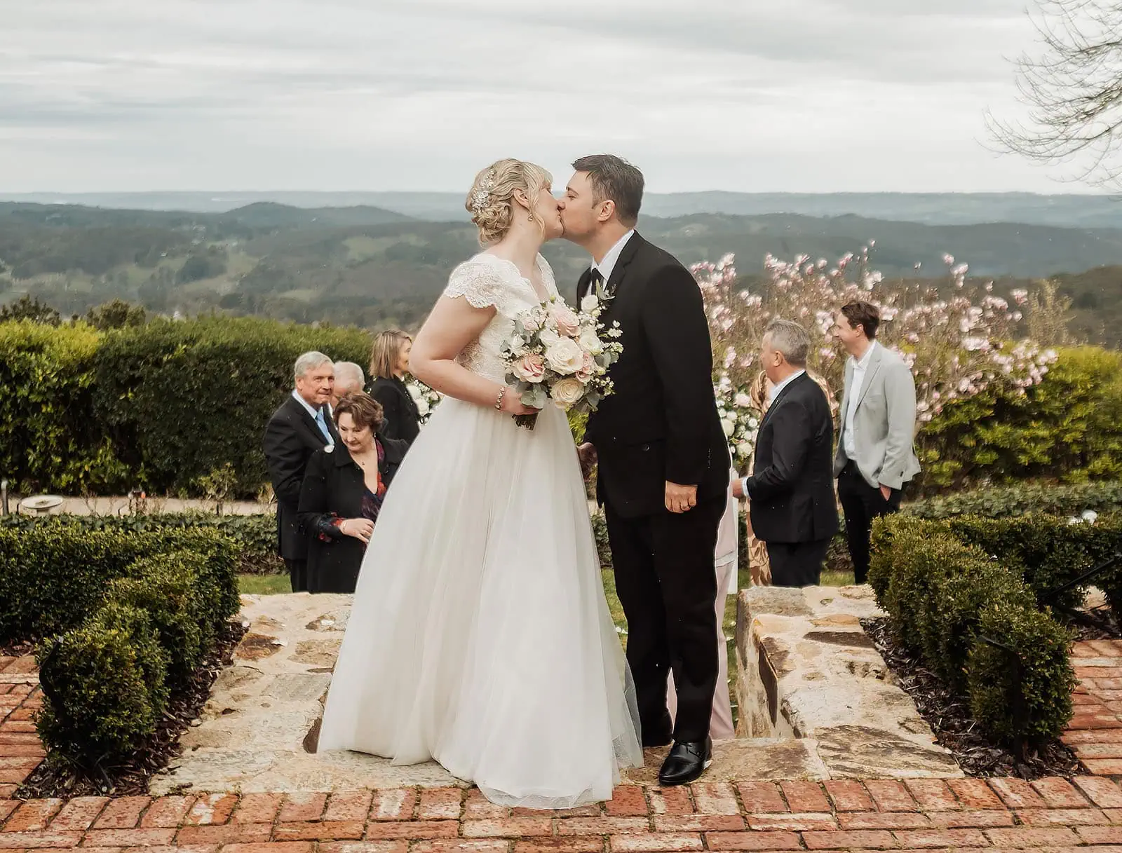mt lofty house elopement - kimberley & michael 188 Bride and groom share a kiss at beautiful outdoor wedding ceremony.