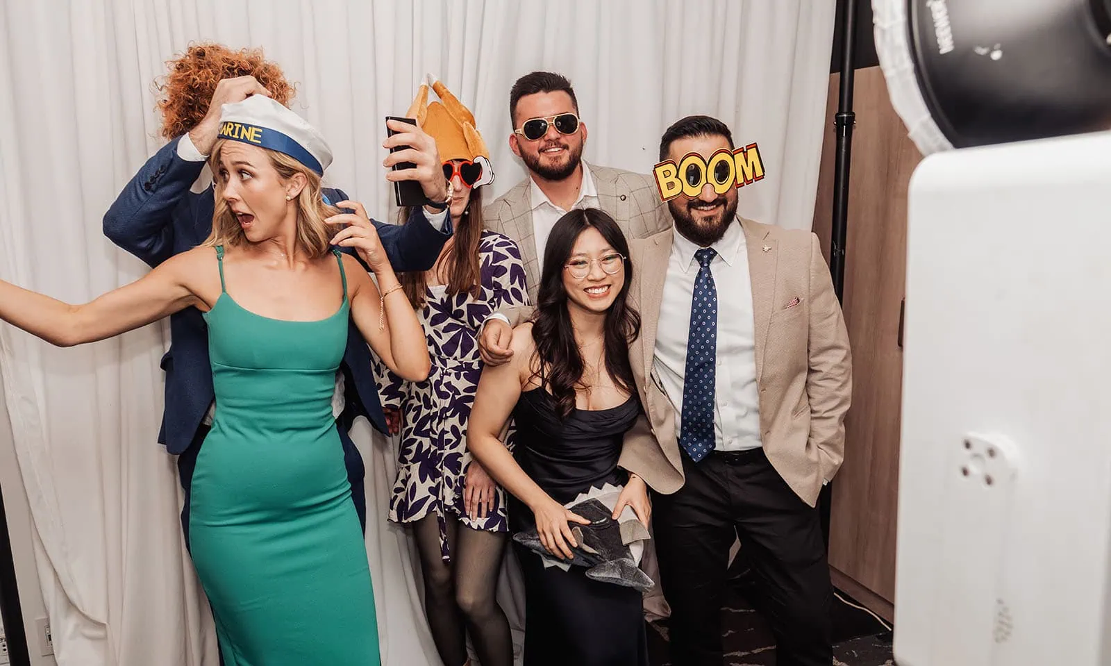adelaide botanic gardens summerhouse wedding - belinda & ian 205 Photo booth excitement with friends at a party.