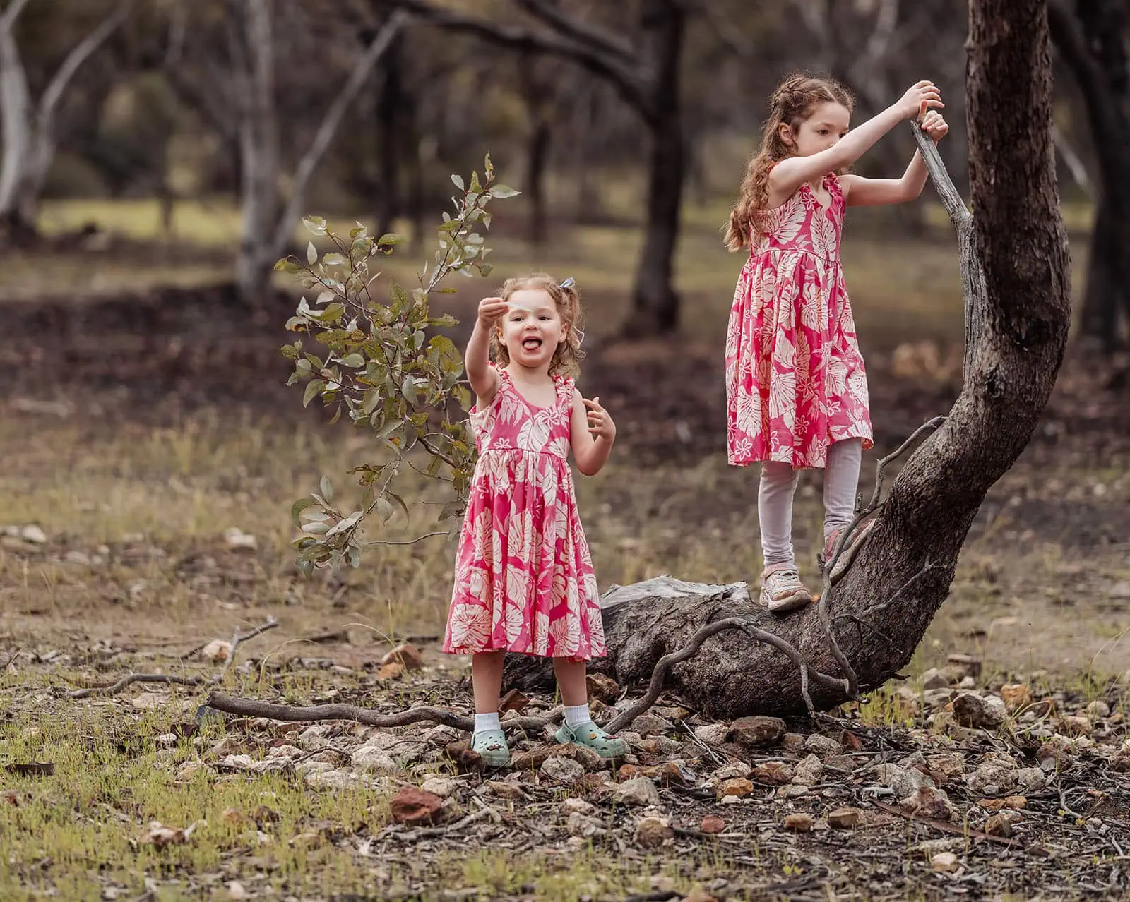happy valley reservoir family photoshoot 8 Girls laughing and playing in a serene forest setting.