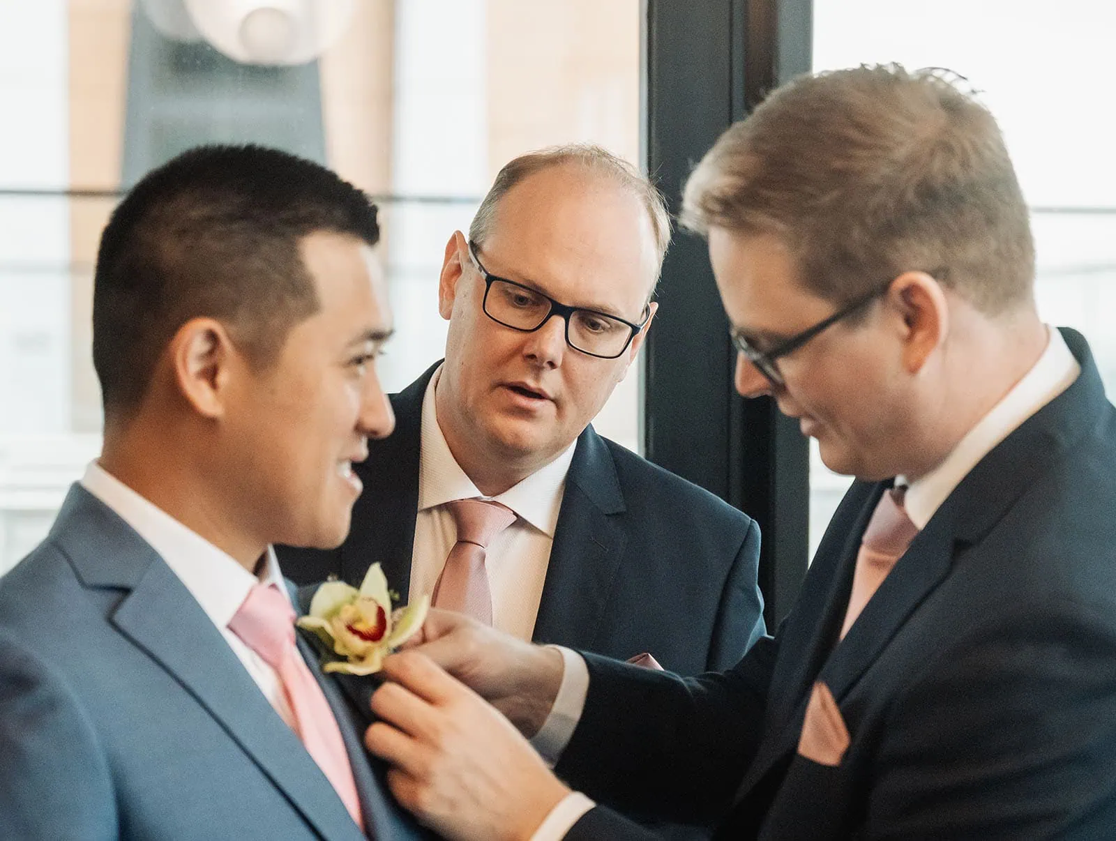 adelaide botanic gardens summerhouse wedding - belinda & ian 129 Groom adjusting boutonniere before wedding ceremony.