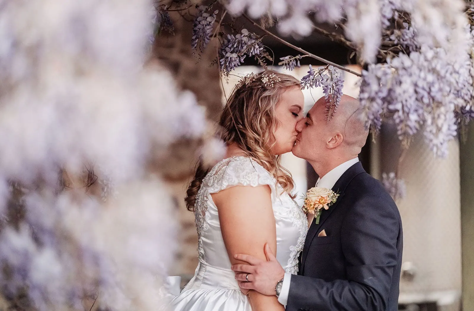 grand cru estate wedding - isabella & nick 152 Bride and groom share a romantic kiss at their wedding ceremony.