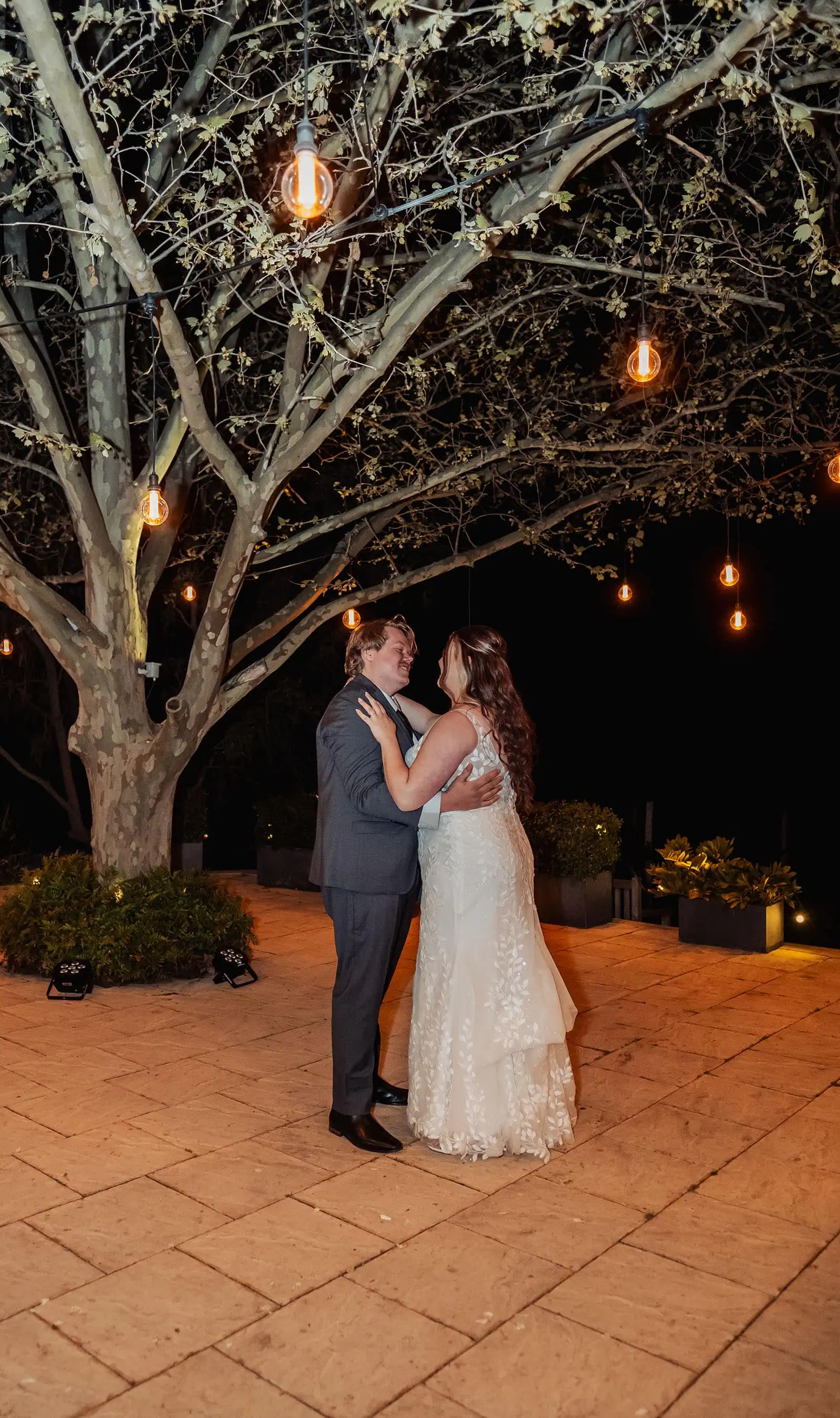 beach rd wines wedding - hana & jessie 96 Elegant couple dancing under the moonlight, romantic evening ambiance.
