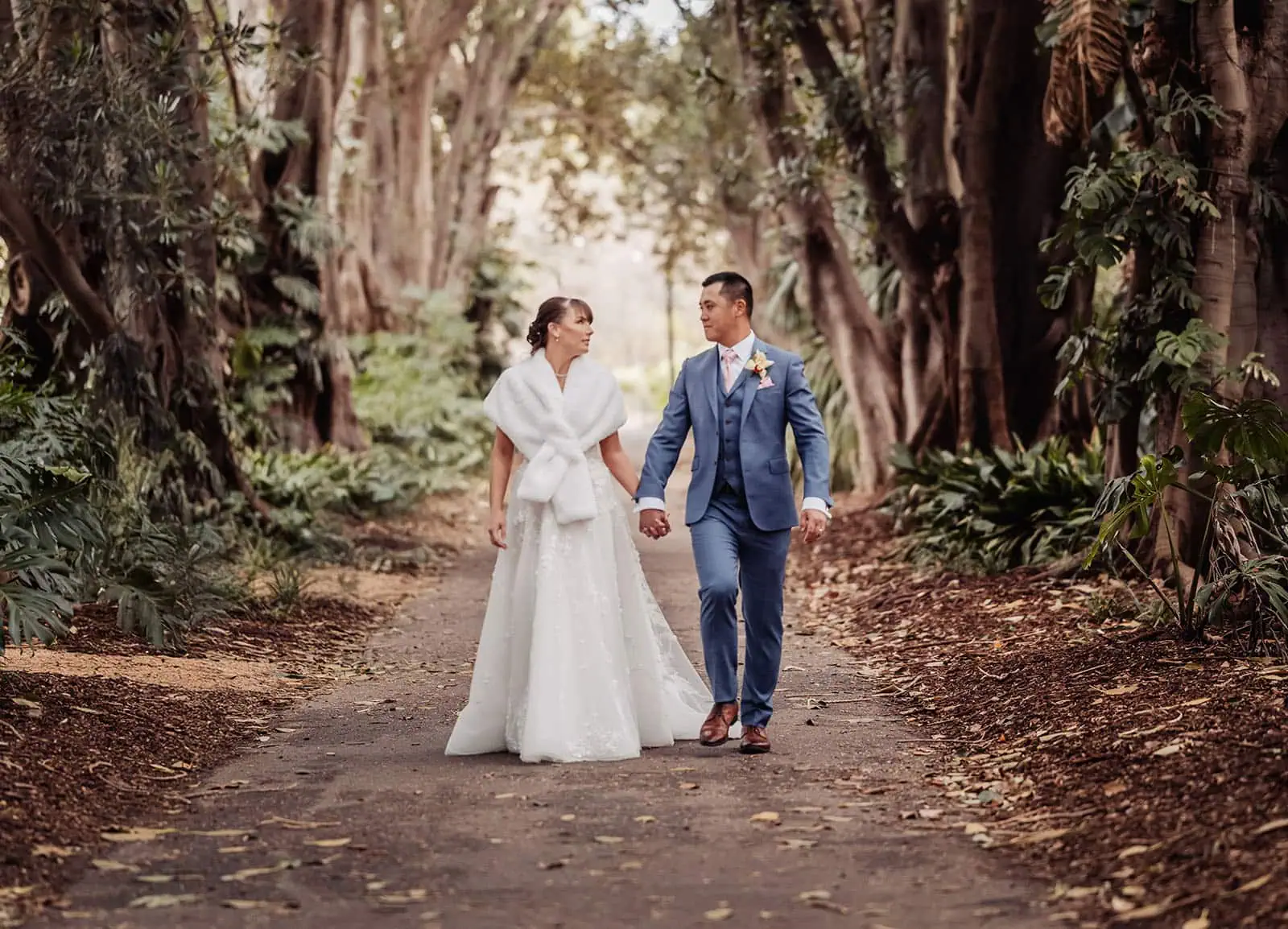 adelaide botanic gardens summerhouse wedding - belinda & ian 191 Magical forest wedding scene with lush greenery and romantic decor.