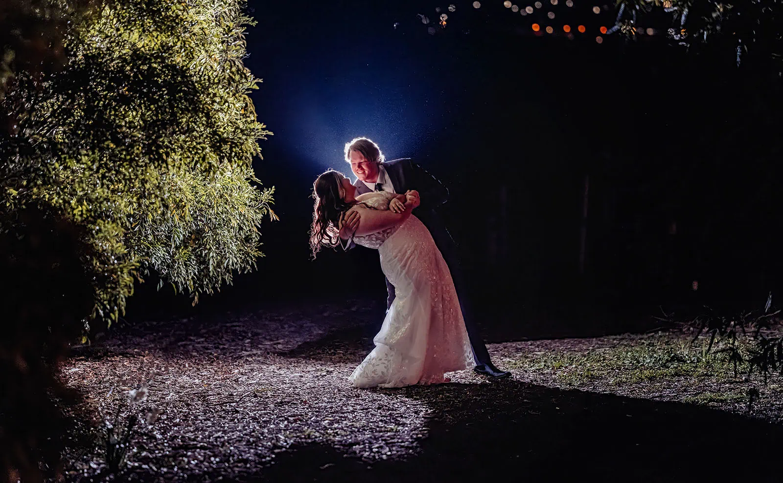 beach rd wines wedding - hana & jessie 92 Romantic wedding evening, candlelit ambience, newlyweds dance, moonlit night.