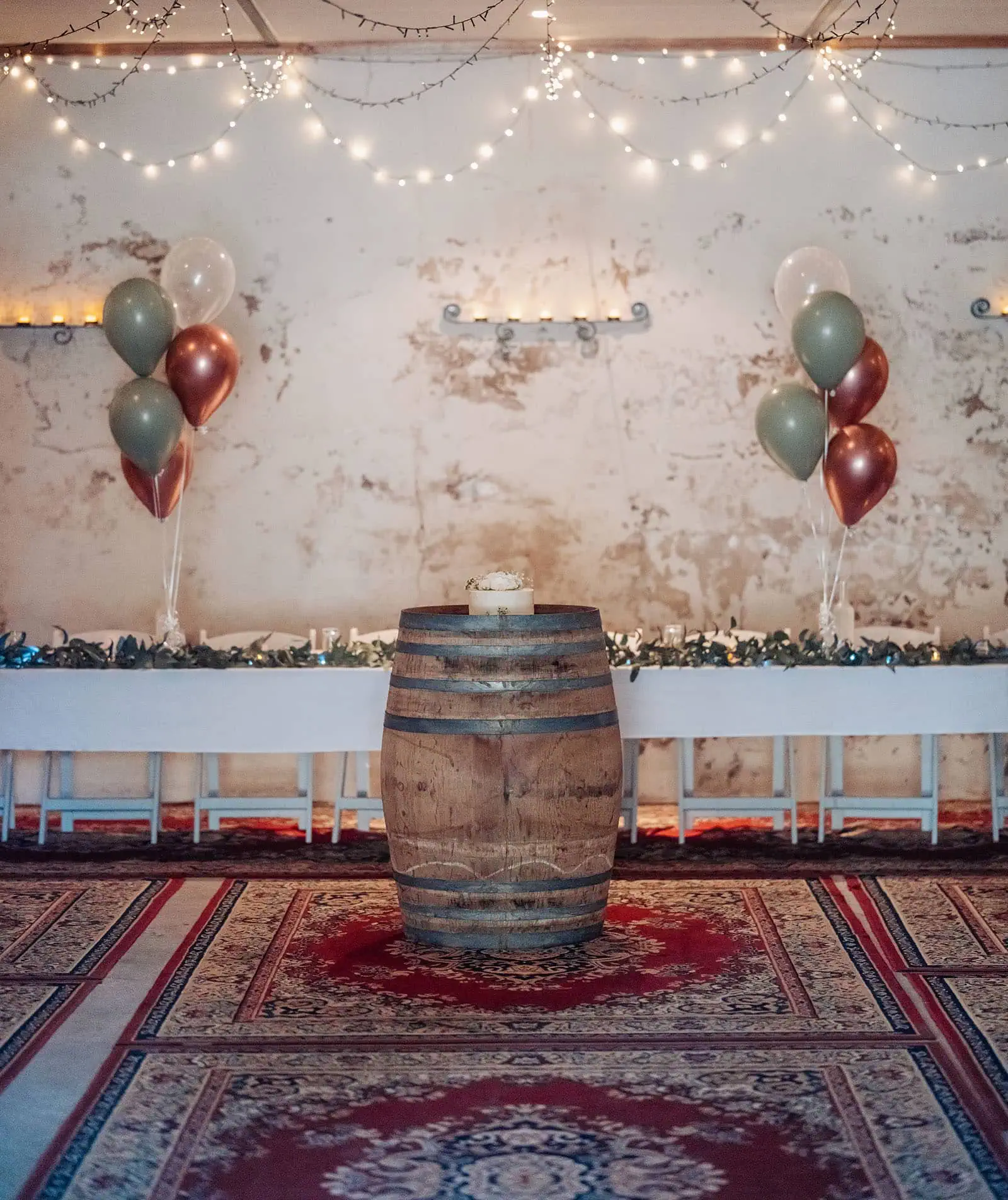 grand cru estate wedding - isabella & nick 154 Rustic event decor with wooden accents and warm lighting for a cozy atmosphere.