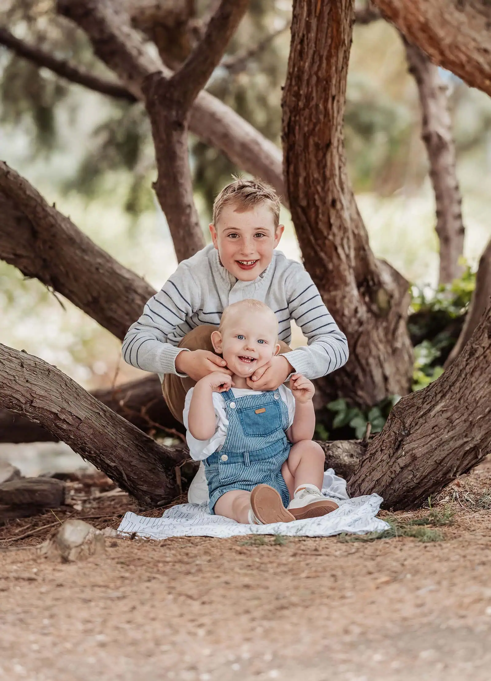 southern parklands family photography 24 Happy siblings playing outdoors, joyful family fun in nature.