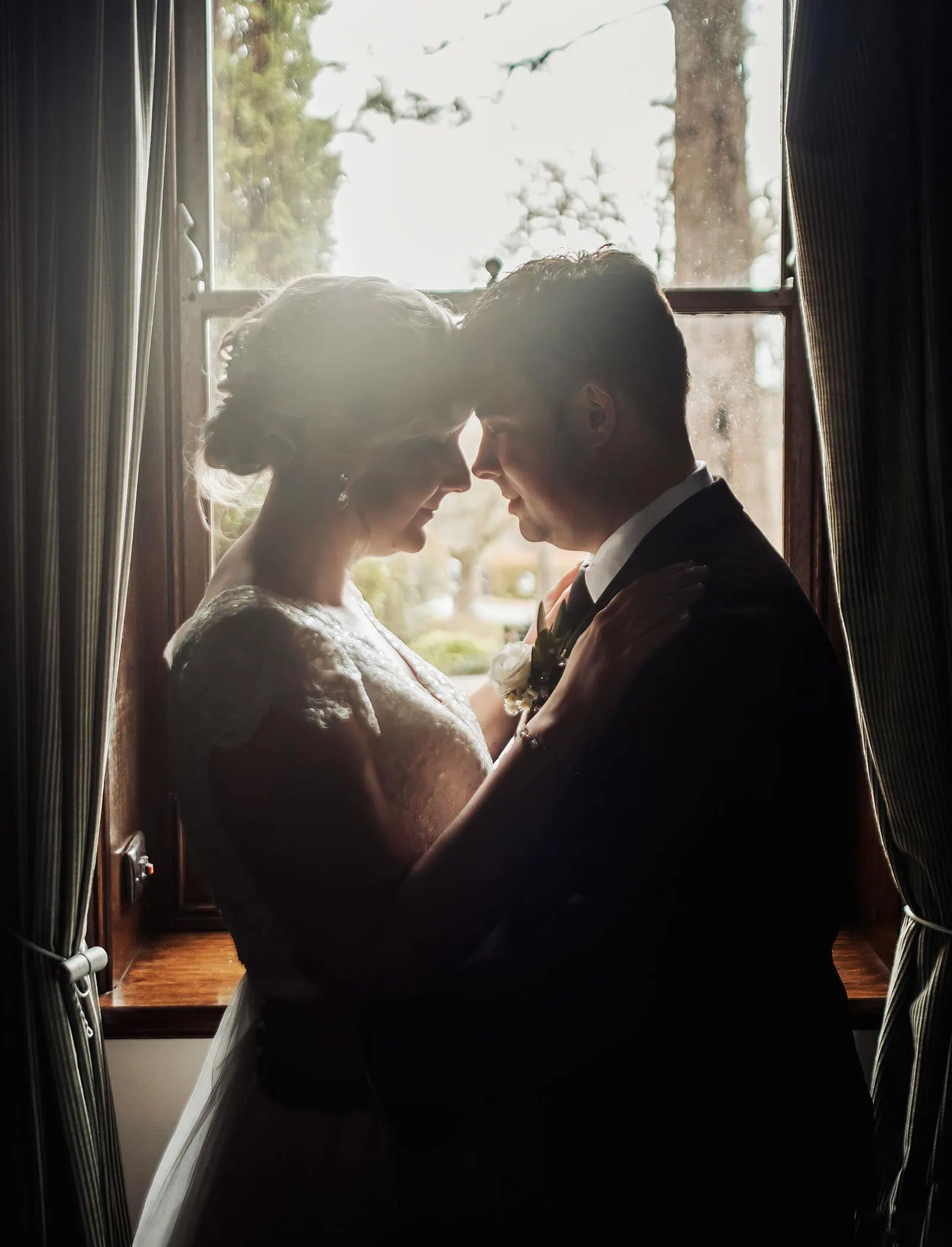 mt lofty house elopement - kimberley & michael 193 Romantic couple embracing lovingly on a peaceful, sunny day outdoors.