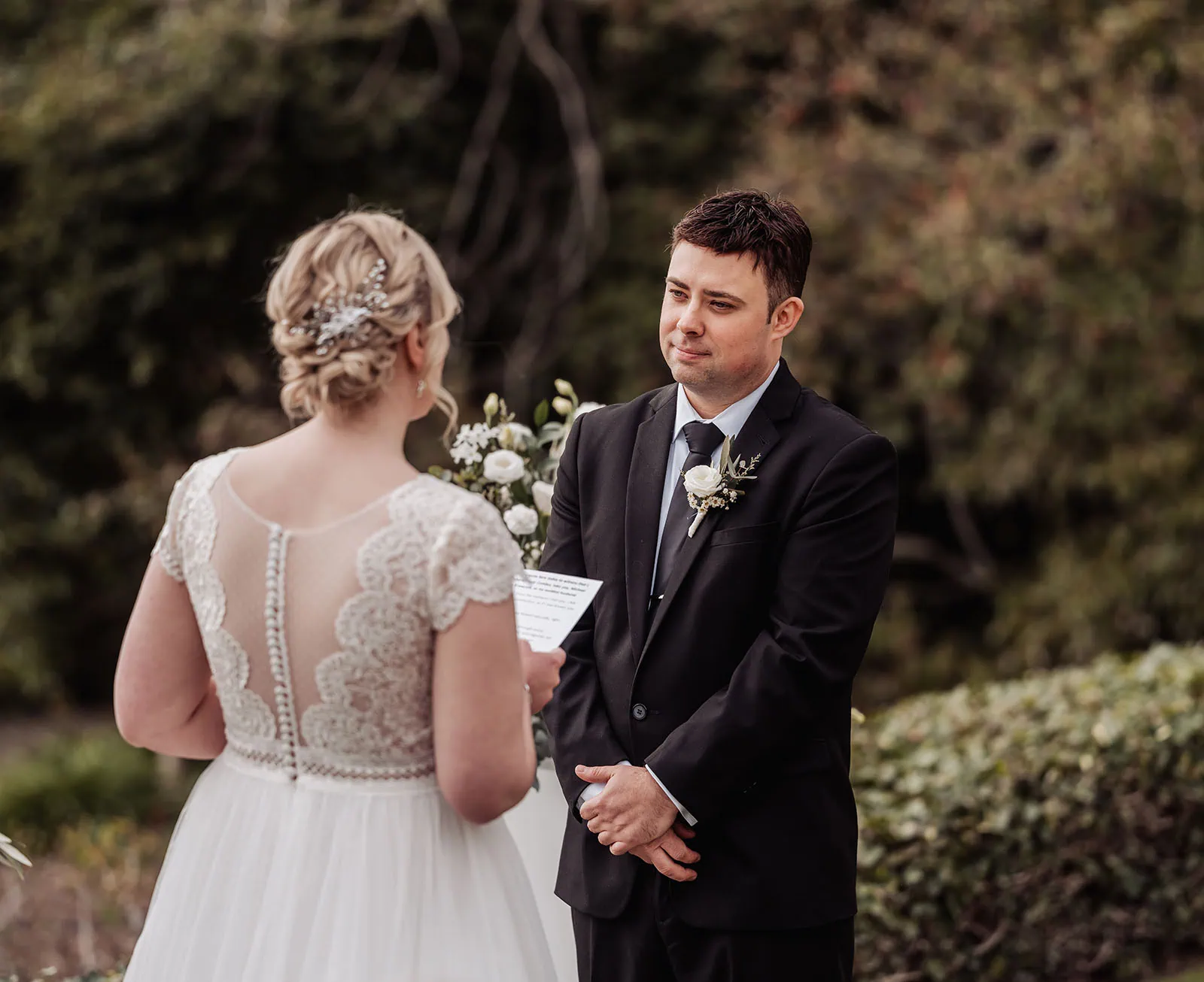 mt lofty house elopement - kimberley & michael 182 Bride and groom exchange vows at elegant outdoor wedding ceremony.