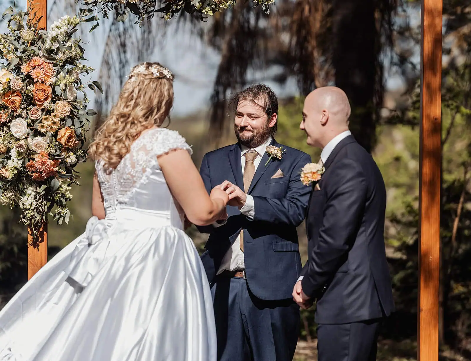 grand cru estate wedding - isabella & nick 127 Outdoor wedding ceremony with elegant floral decorations and seated guests.