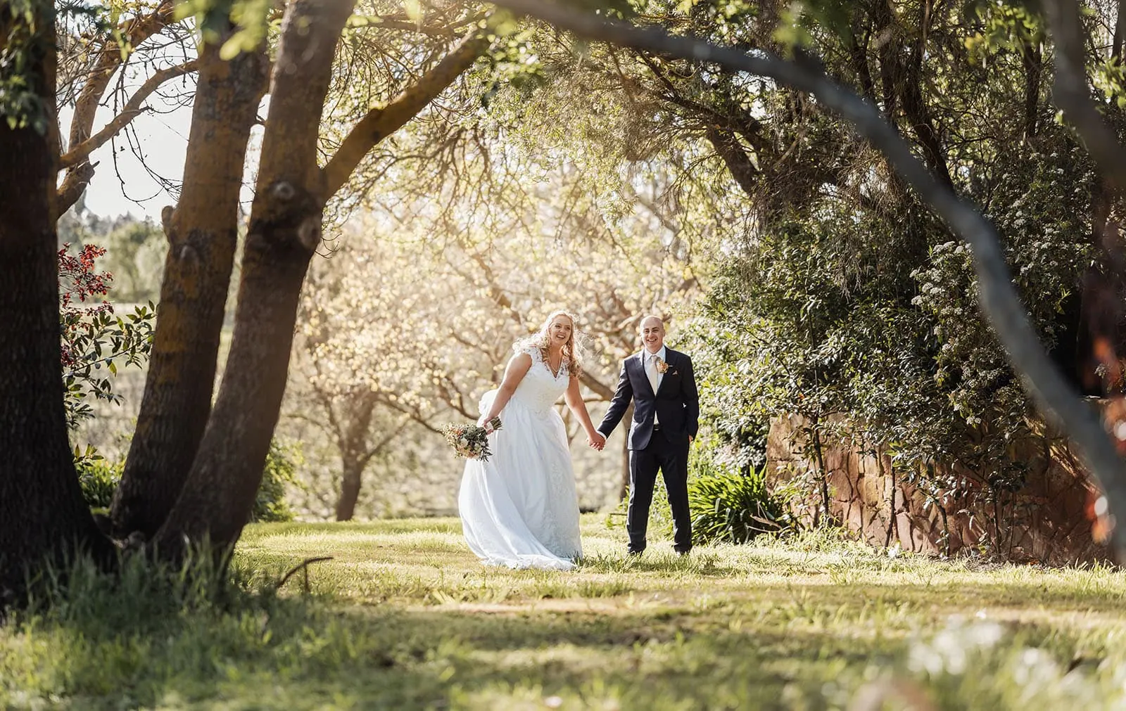 grand cru estate wedding - isabella & nick 141 Bride and groom in garden wedding ceremony.