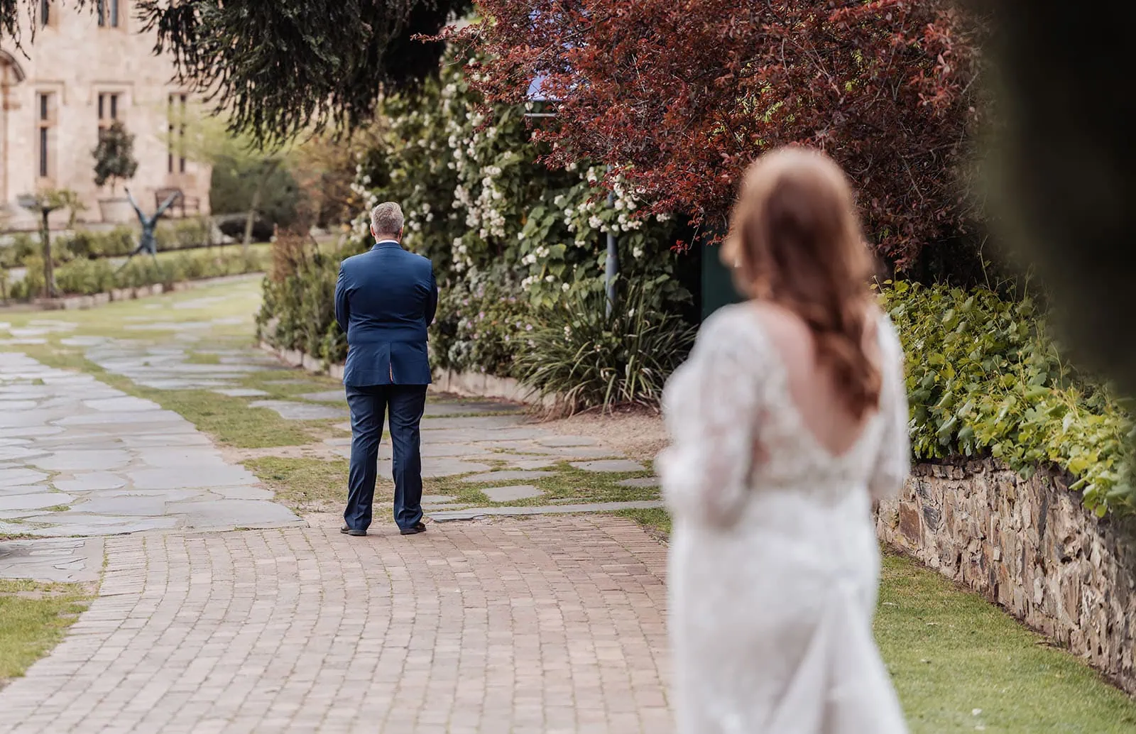 carrick hill wedding - jo & david 275 Bride and groom in a picturesque garden setting, celebrating their wedding day.
