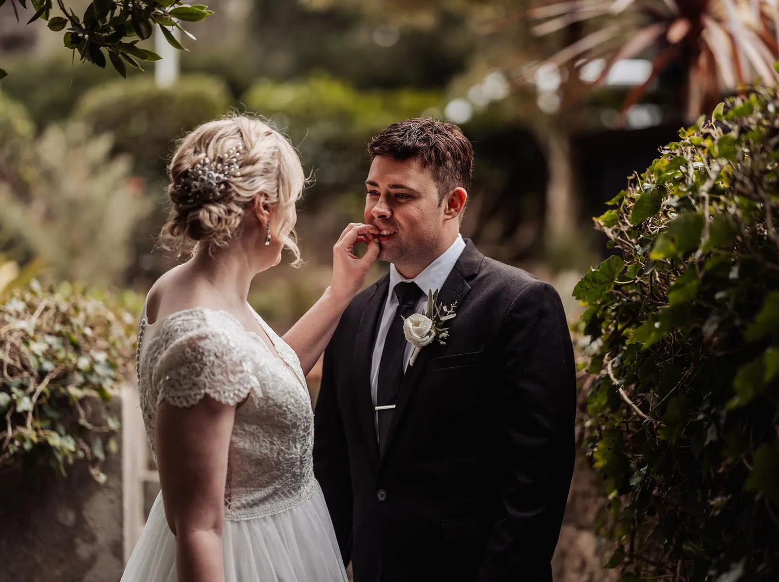 mt lofty house elopement - kimberley & michael 203 Bride and groom embracing in a scenic outdoor wedding ceremony.