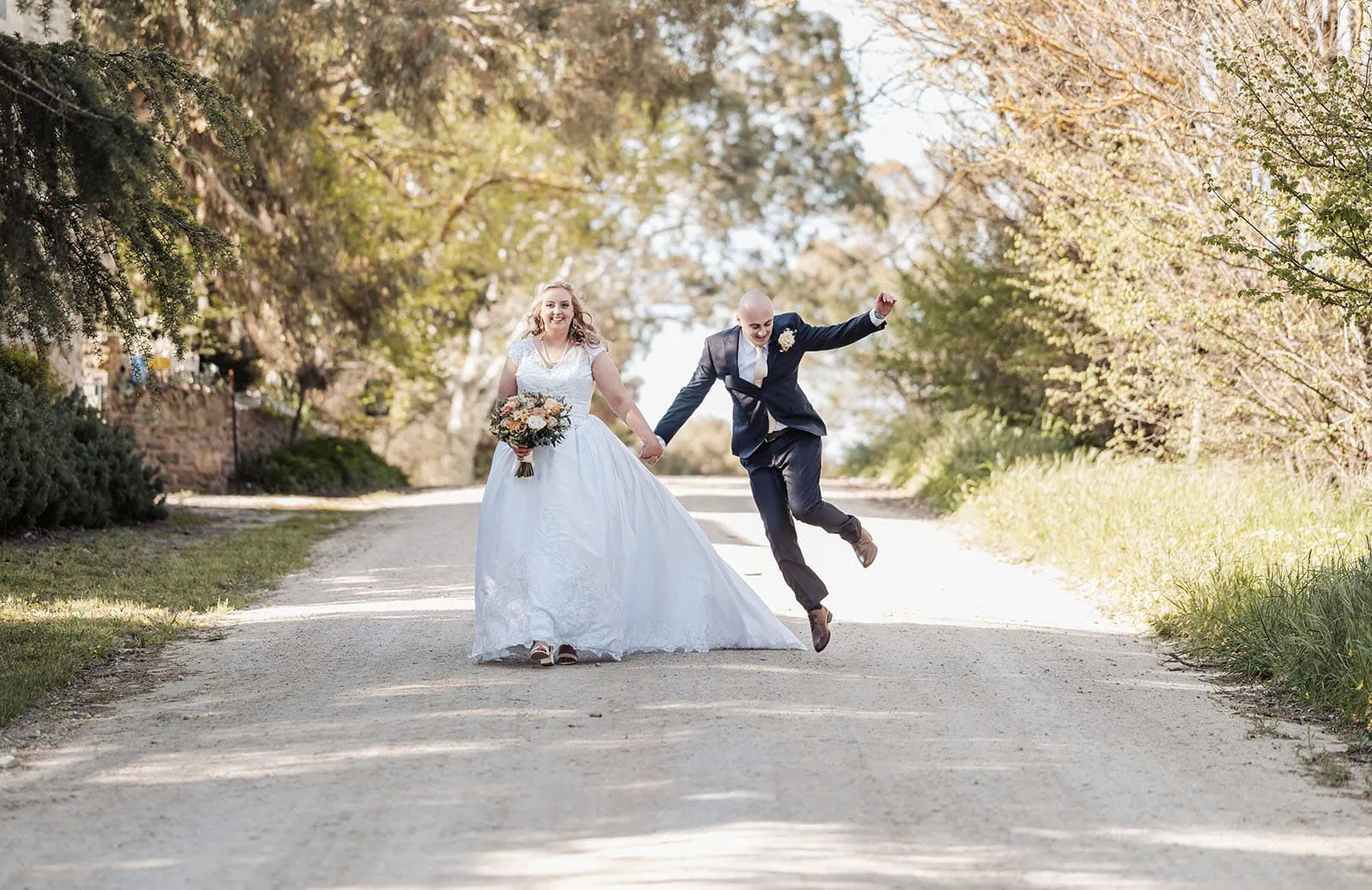 grand cru estate wedding - isabella & nick 139 Bride and groom walking on a scenic path, outdoor wedding, romantic moment captured beautifully.