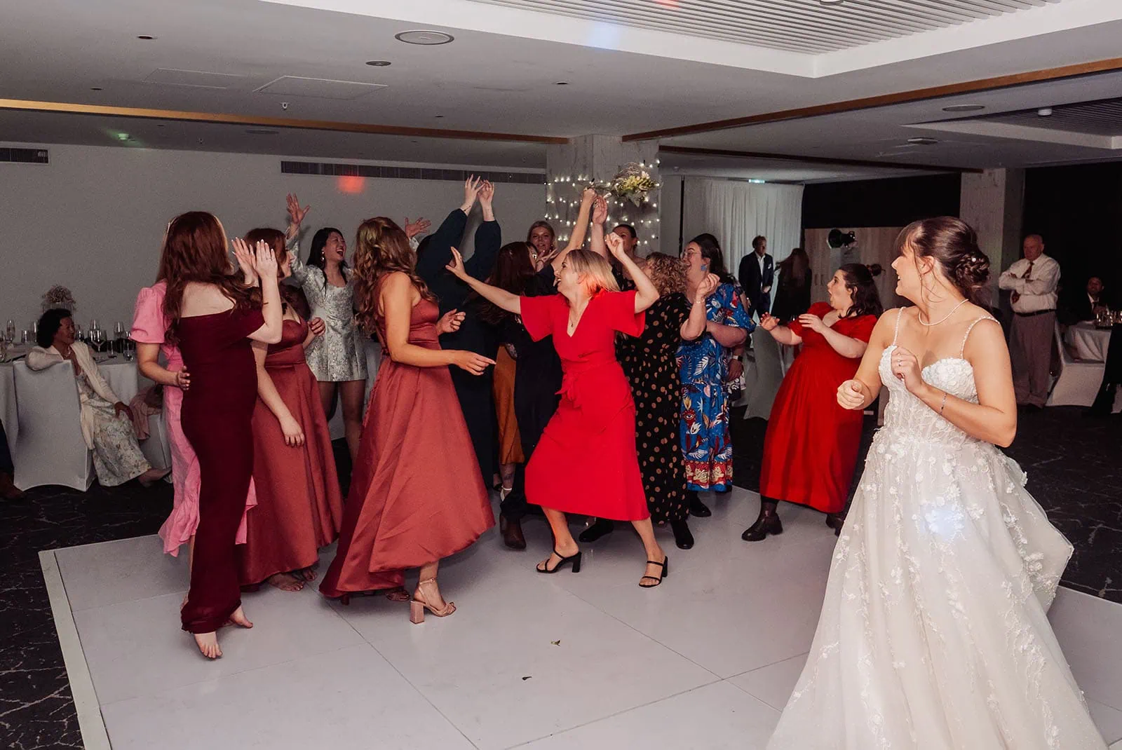 adelaide botanic gardens summerhouse wedding - belinda & ian 211 Couple joyfully dances at wedding celebration, embodying love and happiness.