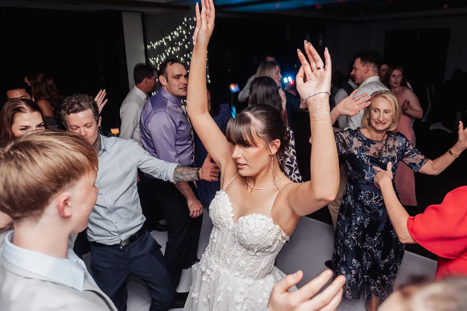 adelaide botanic gardens summerhouse wedding - belinda & ian 210 Bride and groom joyfully dancing at wedding celebration.