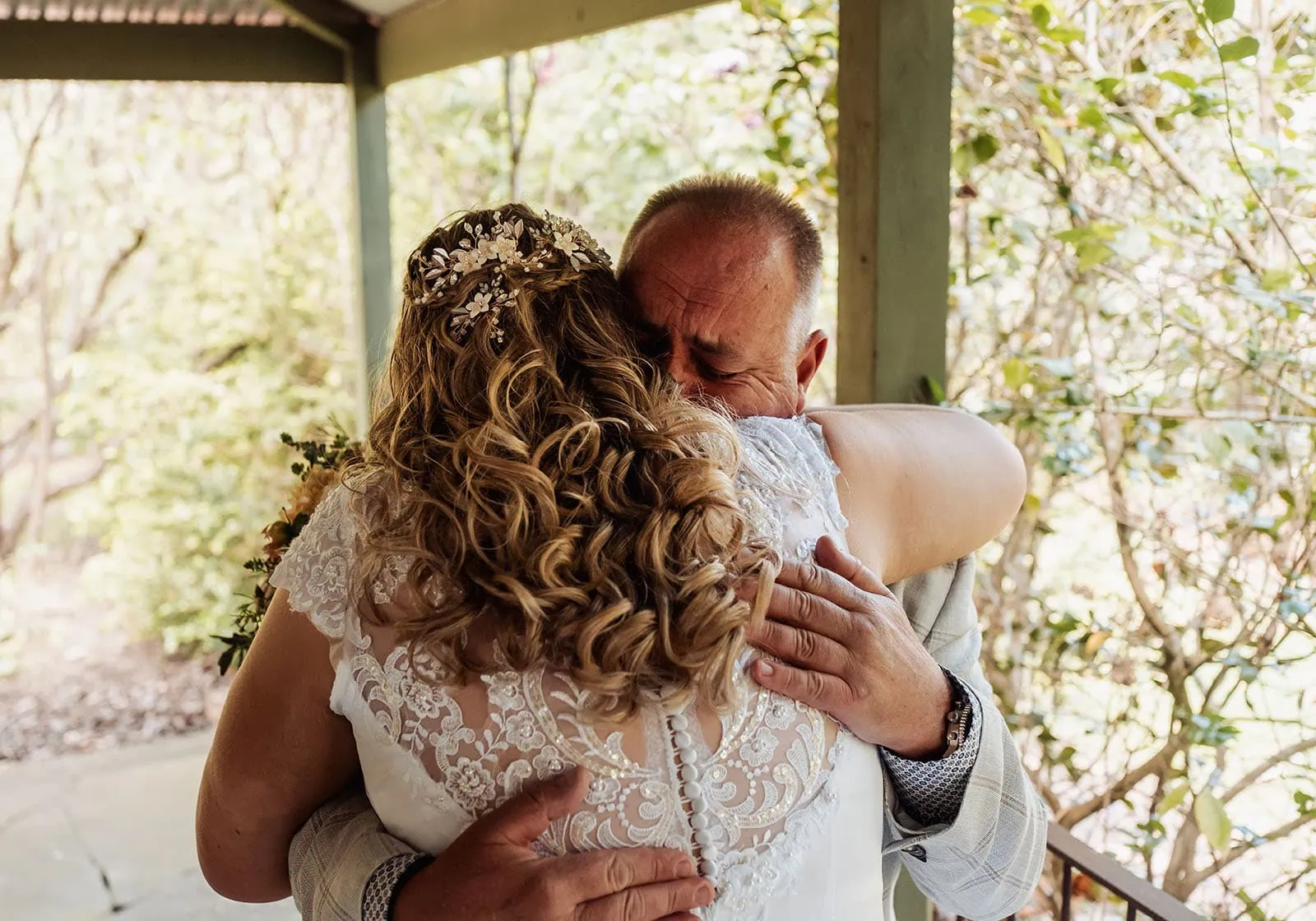 grand cru estate wedding - isabella & nick 113 Bride and groom share a joyful embrace at their elegant wedding ceremony.