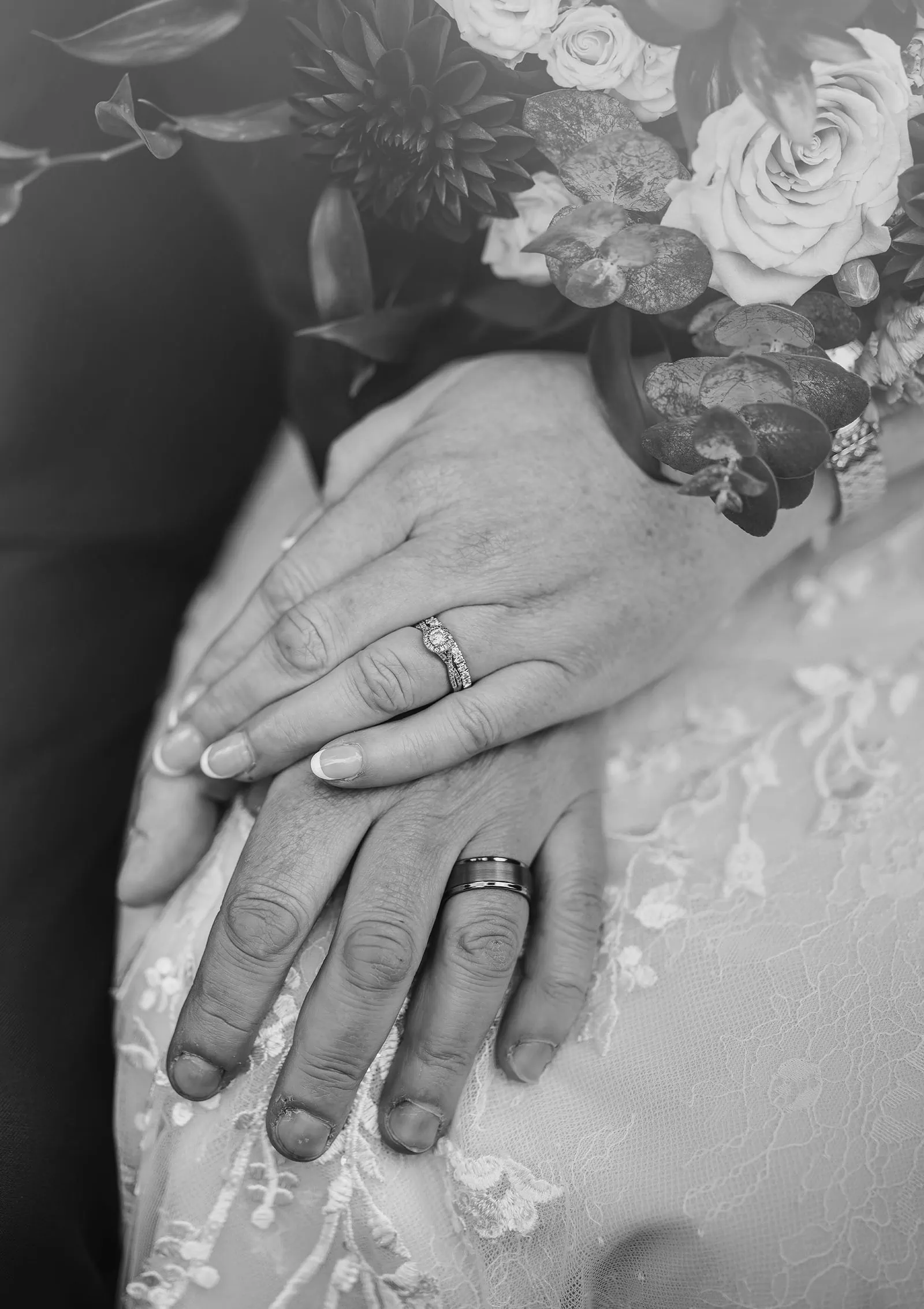 carrick hill wedding - jo & david 287 Black and white photo of wedding rings on intertwined hands.