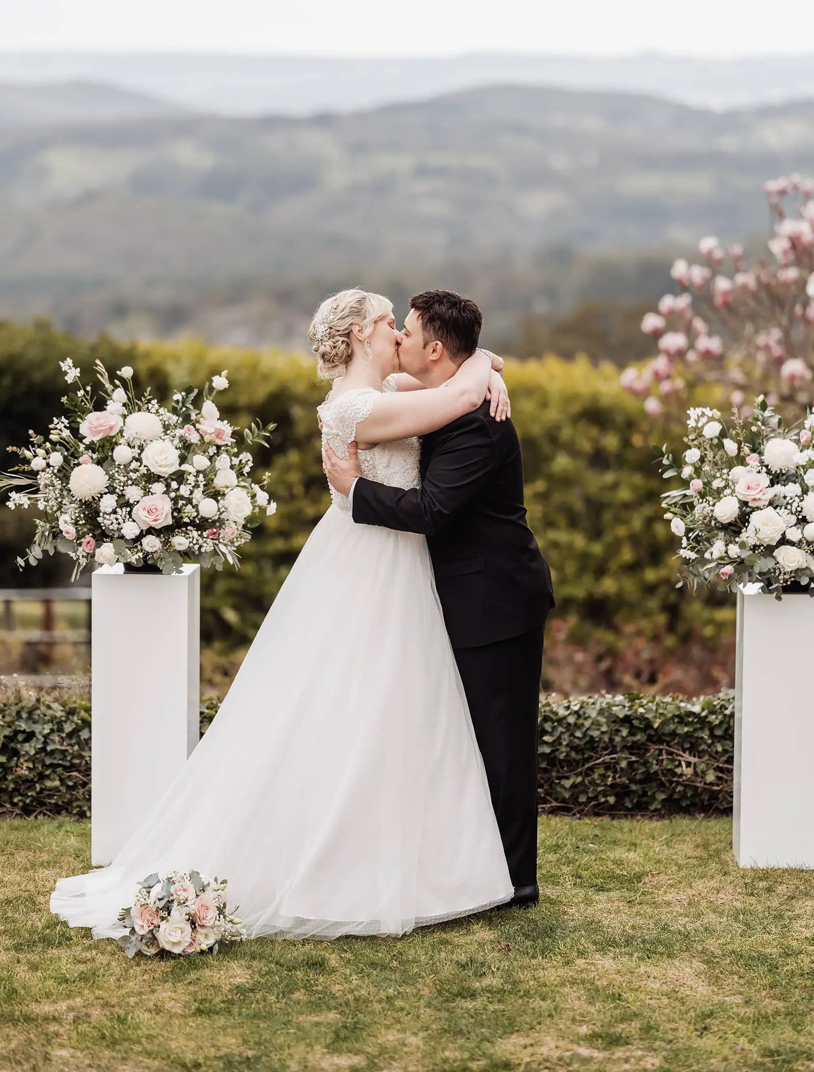 mt lofty house elopement - kimberley & michael 184 Bride and groom sharing romantic outdoor wedding kiss in nature.