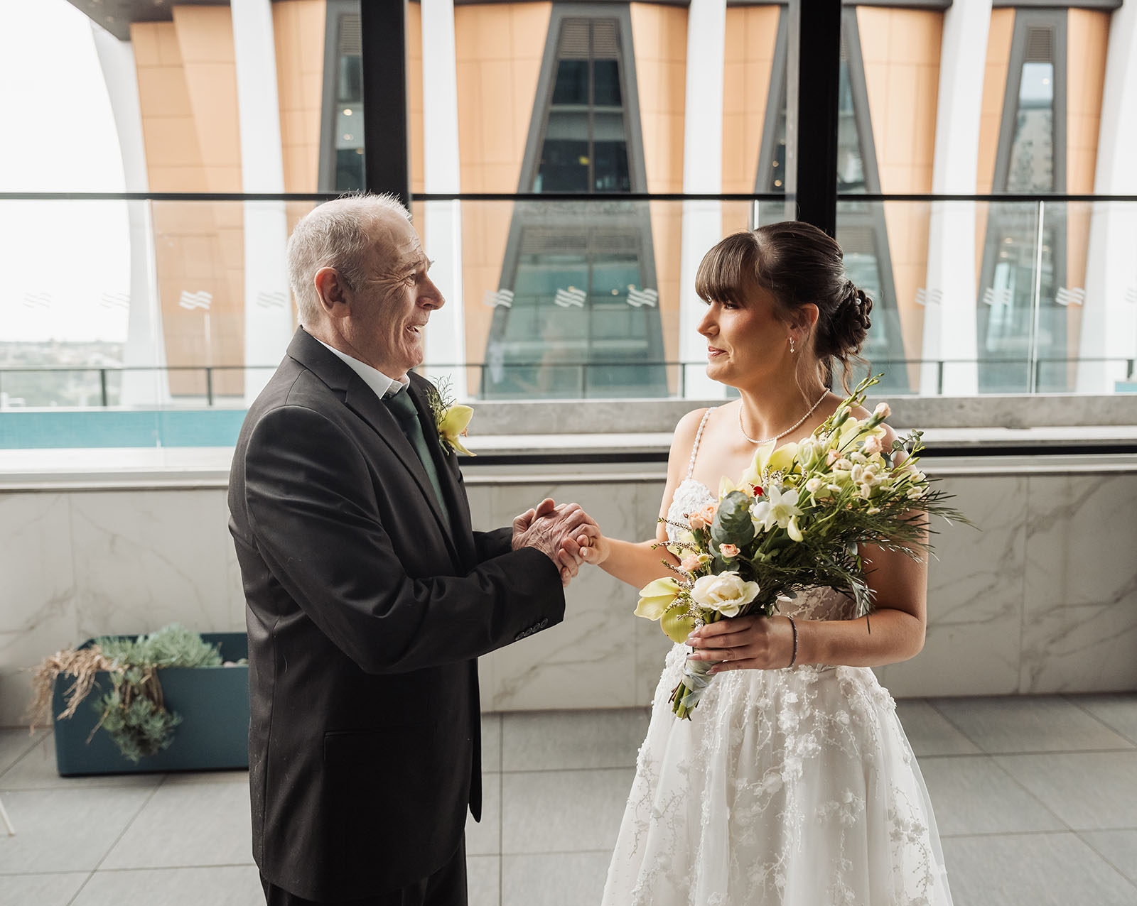adelaide botanic gardens summerhouse wedding - belinda & ian 153 Bride and groom share a joyful wedding moment, capturing love and happiness.