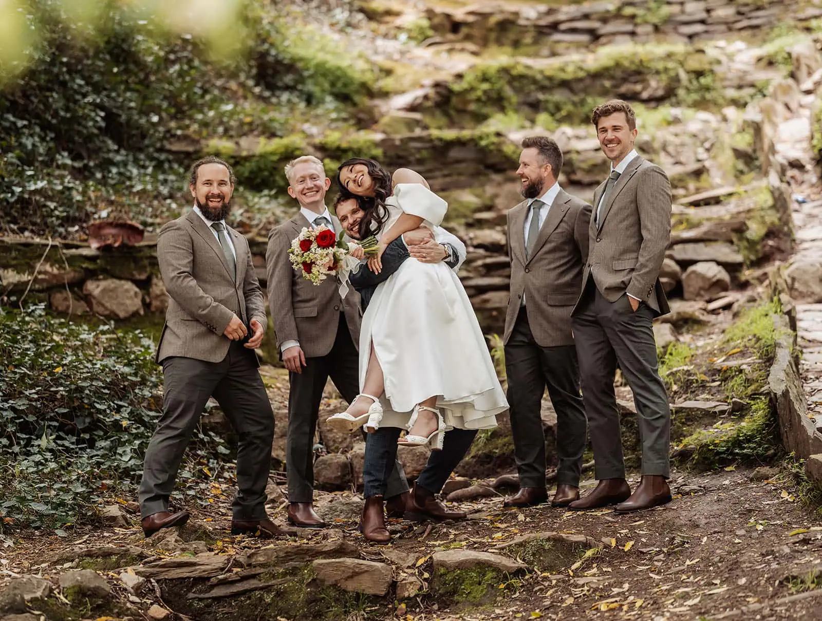 utopia waterfall gully wedding - sally & ben 247 Outdoor wedding celebration with joyful guests and elegant decor.