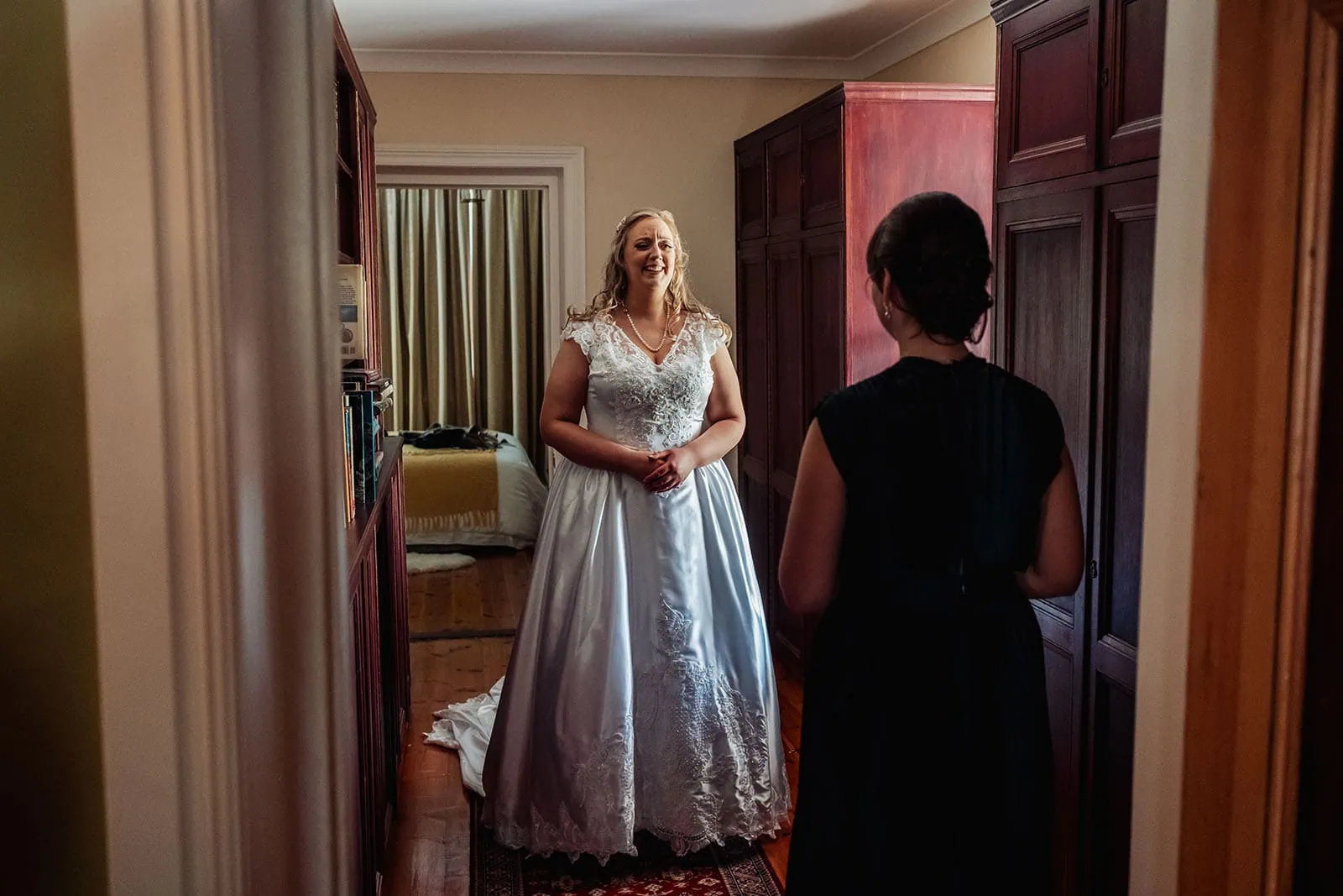 grand cru estate wedding - isabella & nick 110 Bride preparing for wedding day with elegant dress and joyful anticipation.