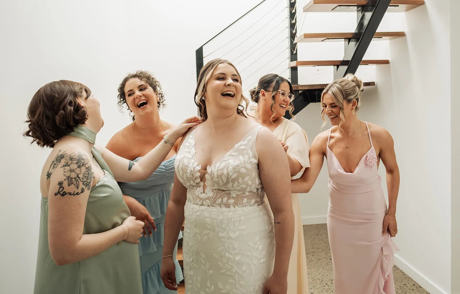 beach rd wines wedding - hana & jessie 46 Bridal party getting ready, wedding day excitement, elegant dresses, joyful moments.