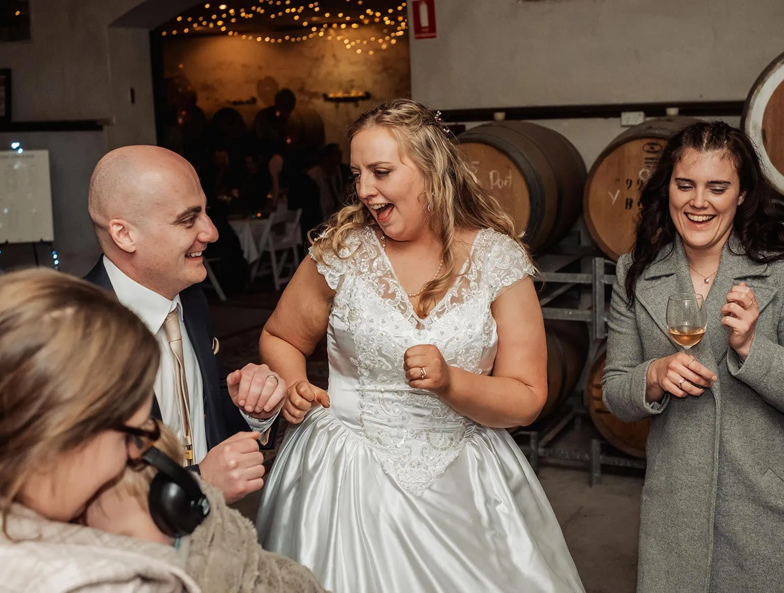 grand cru estate wedding - isabella & nick 165 Guests joyfully dancing at a wedding reception, celebrating love and unity.