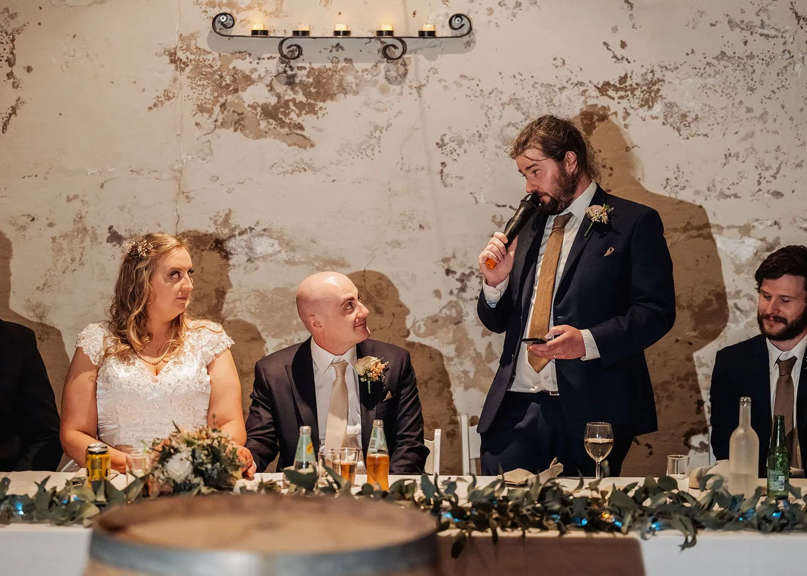 grand cru estate wedding - isabella & nick 160 Guests enjoying heartfelt wedding reception toast with champagne glasses raised.