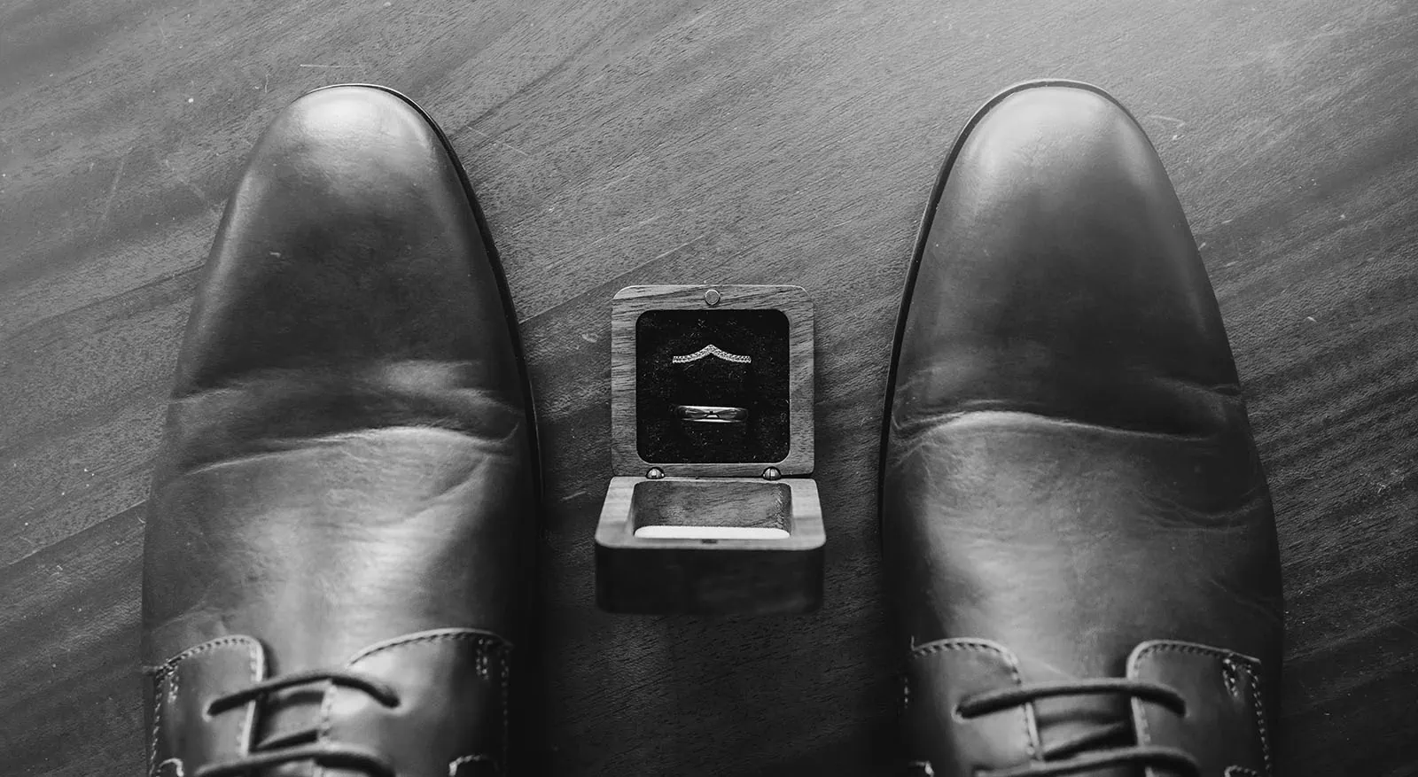 grand cru estate wedding - isabella & nick 94 Wedding rings and brides shoes on elegant display.