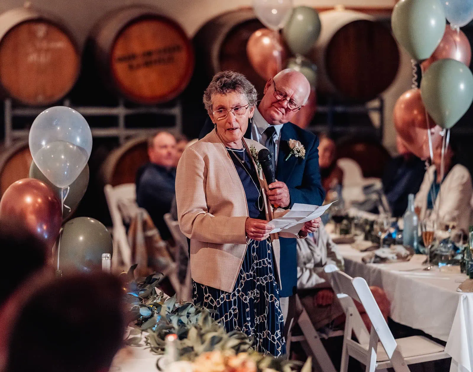 grand cru estate wedding - isabella & nick 159 Luxurious wine cellar showcasing vintage bottles and elegant wood racks.