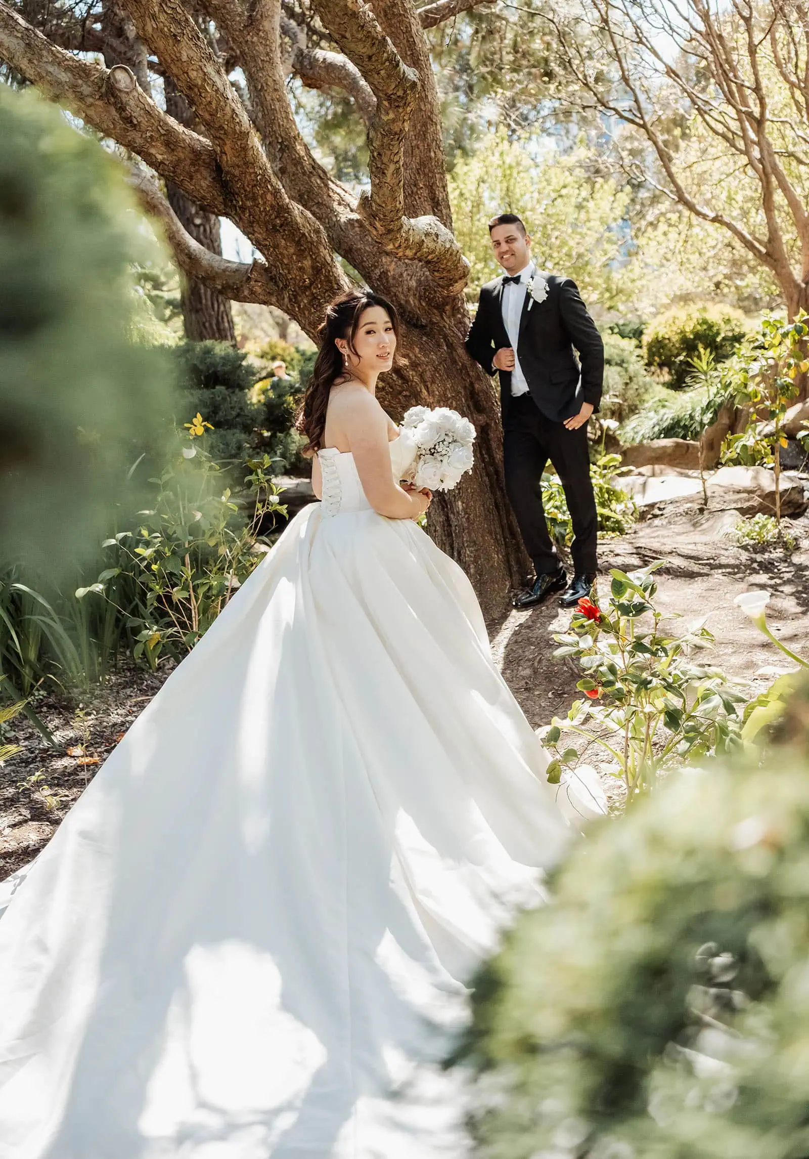 sunnybrae rose garden wedding - celina & anuj 33 Bride and groom in garden wedding, romantic outdoor ceremony setting.