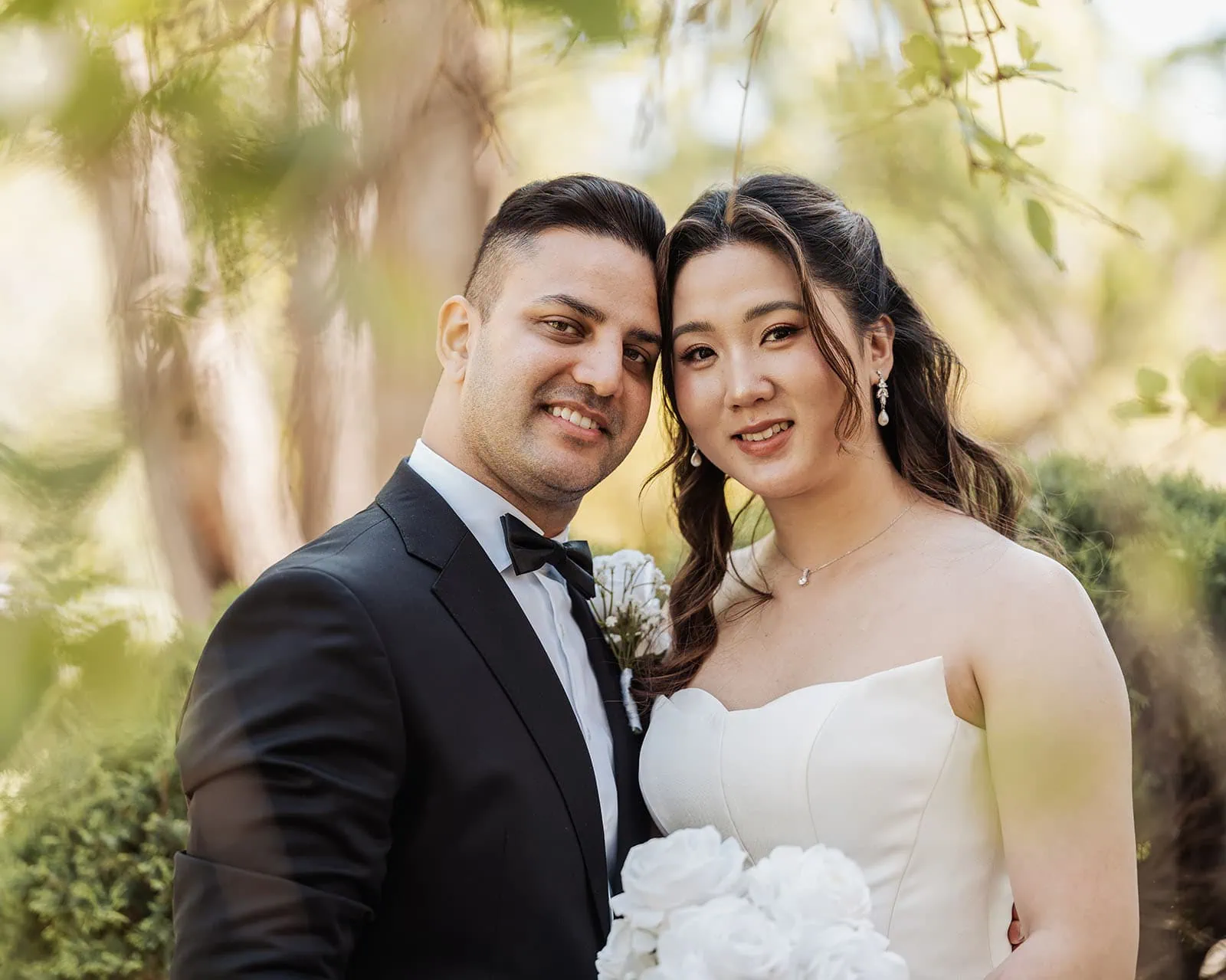 sunnybrae rose garden wedding - celina & anuj 29 Romantic couple posing outdoors during sunset, showcasing love and connection.