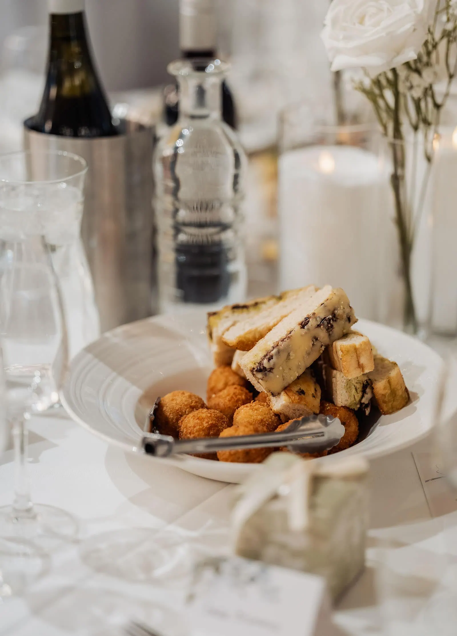 sunnybrae rose garden wedding - celina & anuj 70 Savory croquettes served as delicious appetizers on an elegant dinner table.