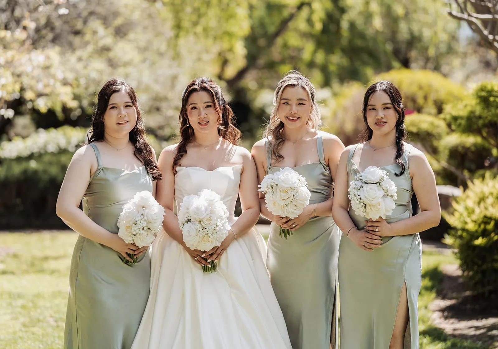 sunnybrae rose garden wedding - celina & anuj 35 Bride and bridesmaids in elegant dresses at a beautiful garden wedding.
