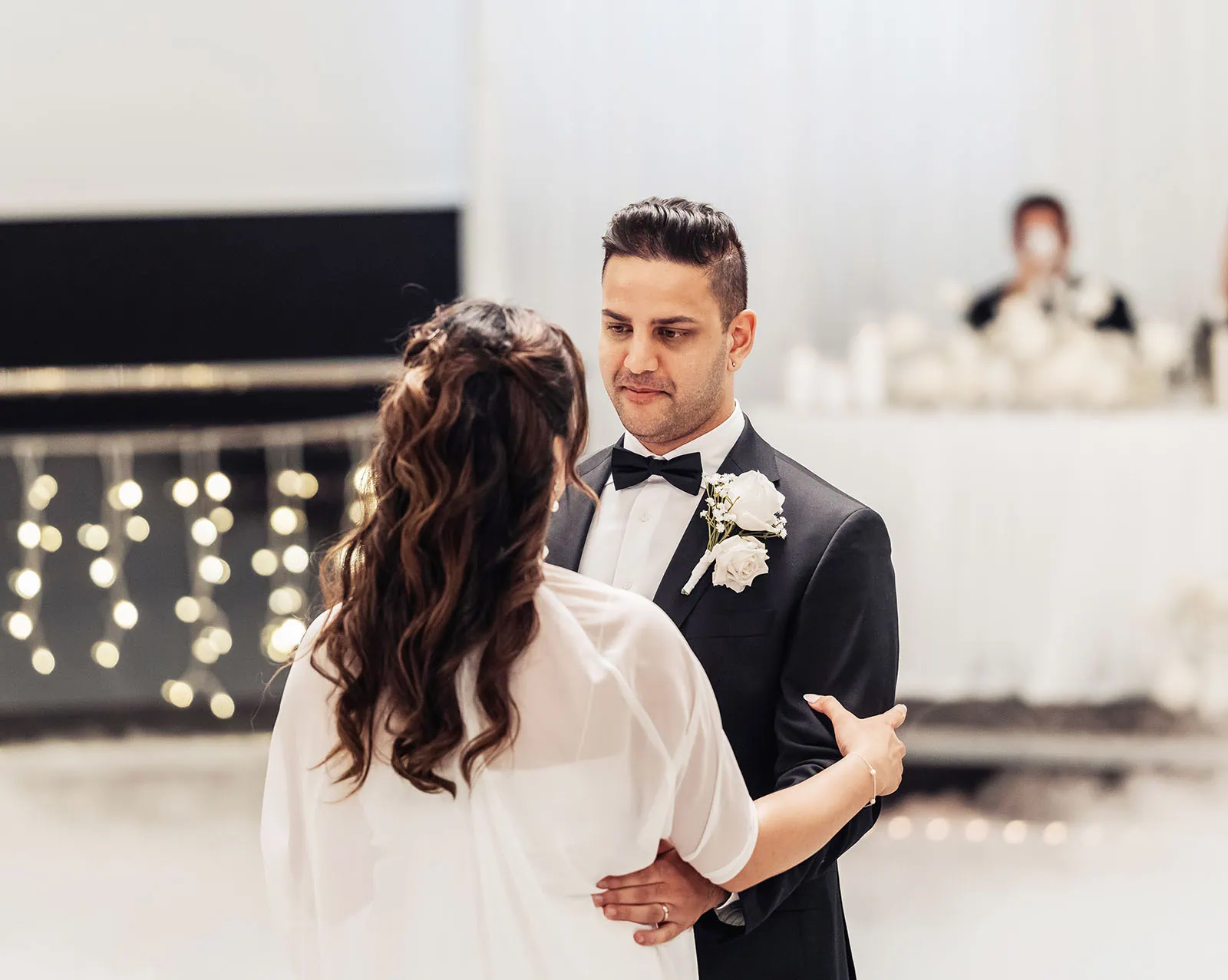 sunnybrae rose garden wedding - celina & anuj 83 Bride and groom share romantic moment at intimate wedding ceremony.