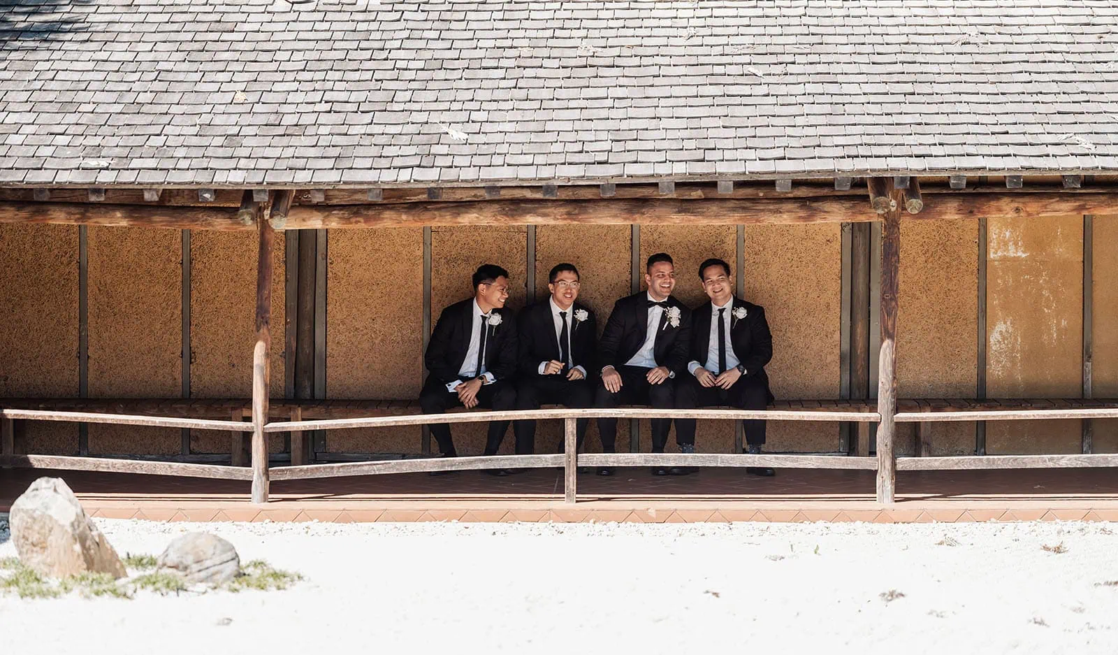 sunnybrae rose garden wedding - celina & anuj 32 Men in formal wear enjoying an outdoor event.