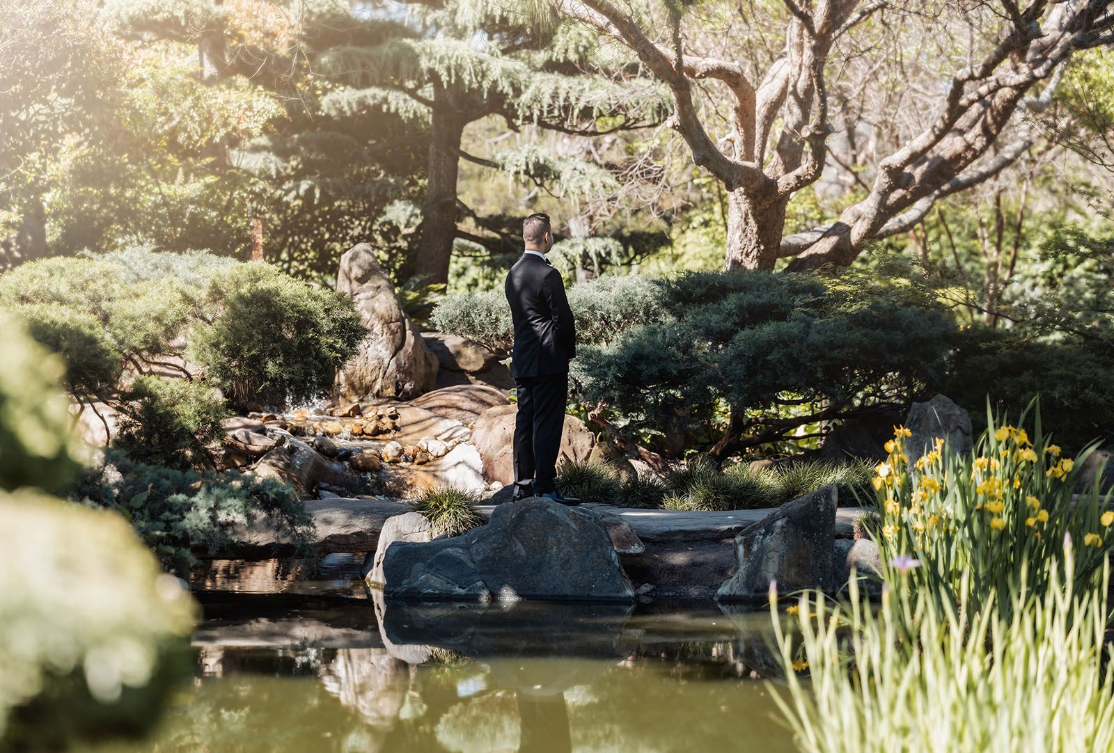 sunnybrae rose garden wedding - celina & anuj 17 Peaceful garden pond with lily pads and colorful koi fish swimming.