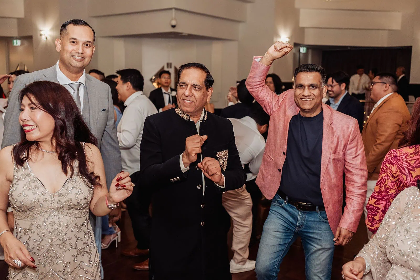 sunnybrae rose garden wedding - celina & anuj 89 Joyful wedding celebration with guests dancing and laughing.