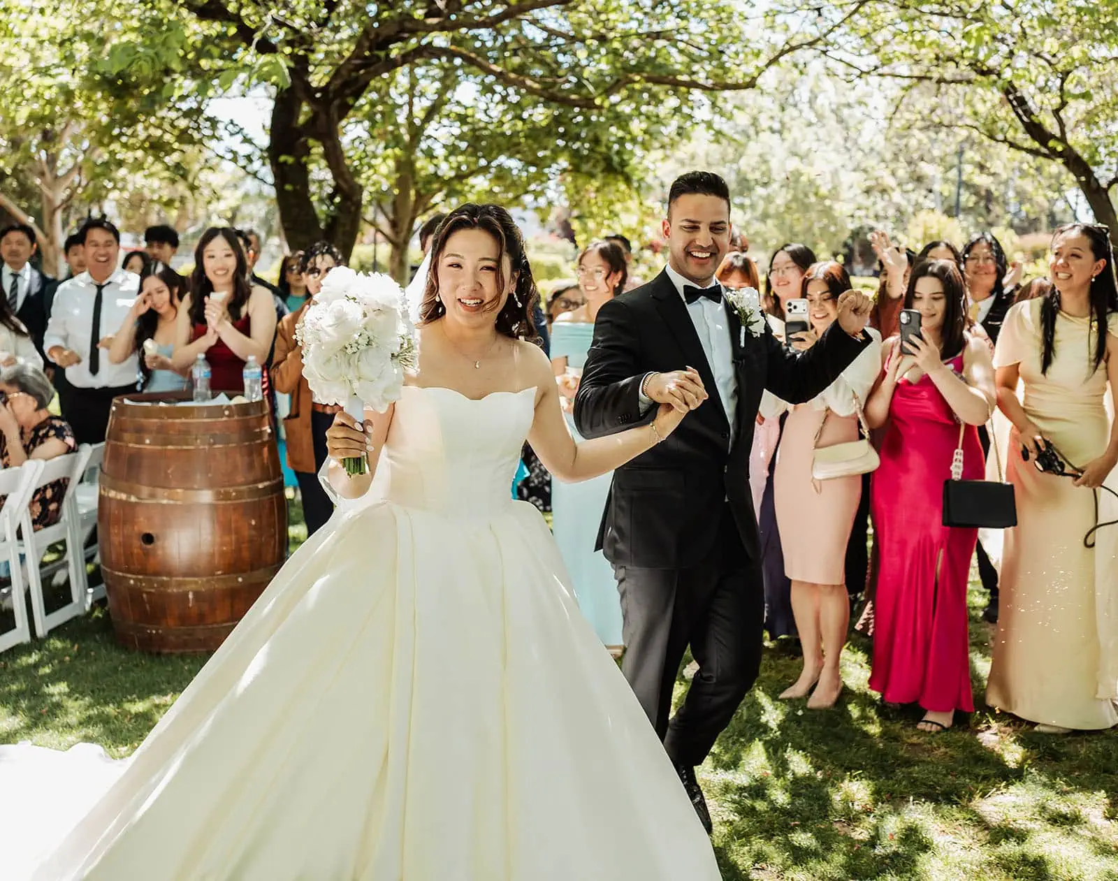 sunnybrae rose garden wedding - celina & anuj 50 Outdoor wedding celebration with happy couple, fairy lights, and elegant decor.