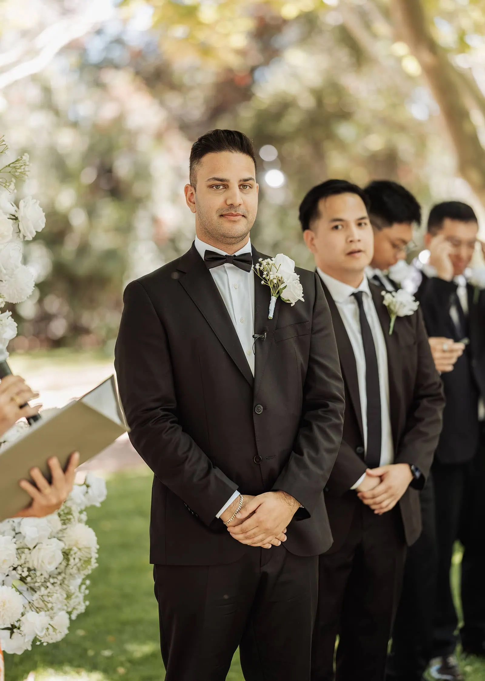 sunnybrae rose garden wedding - celina & anuj 40 Outdoor wedding ceremony with elegant decor and happy couple exchanging vows.