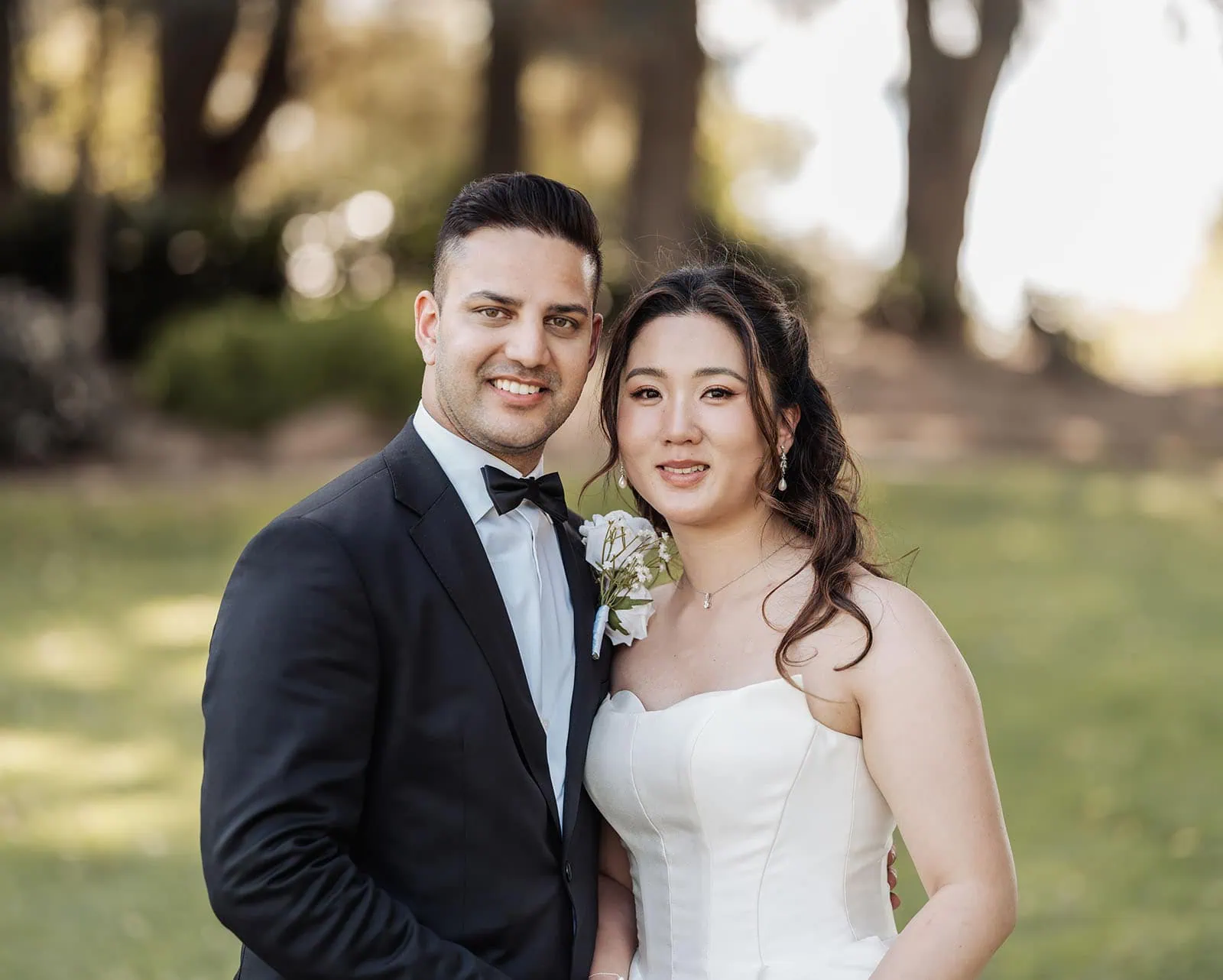 sunnybrae rose garden wedding - celina & anuj 60 Outdoor wedding couple embracing under a sunset, capturing romance and love.