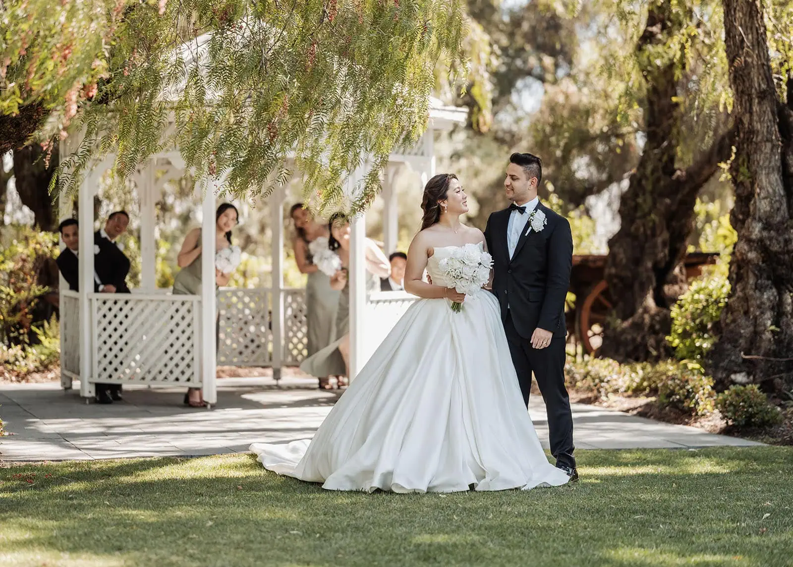 sunnybrae rose garden wedding - celina & anuj 55 Garden wedding with elegant gazebo surrounded by blooming flowers.