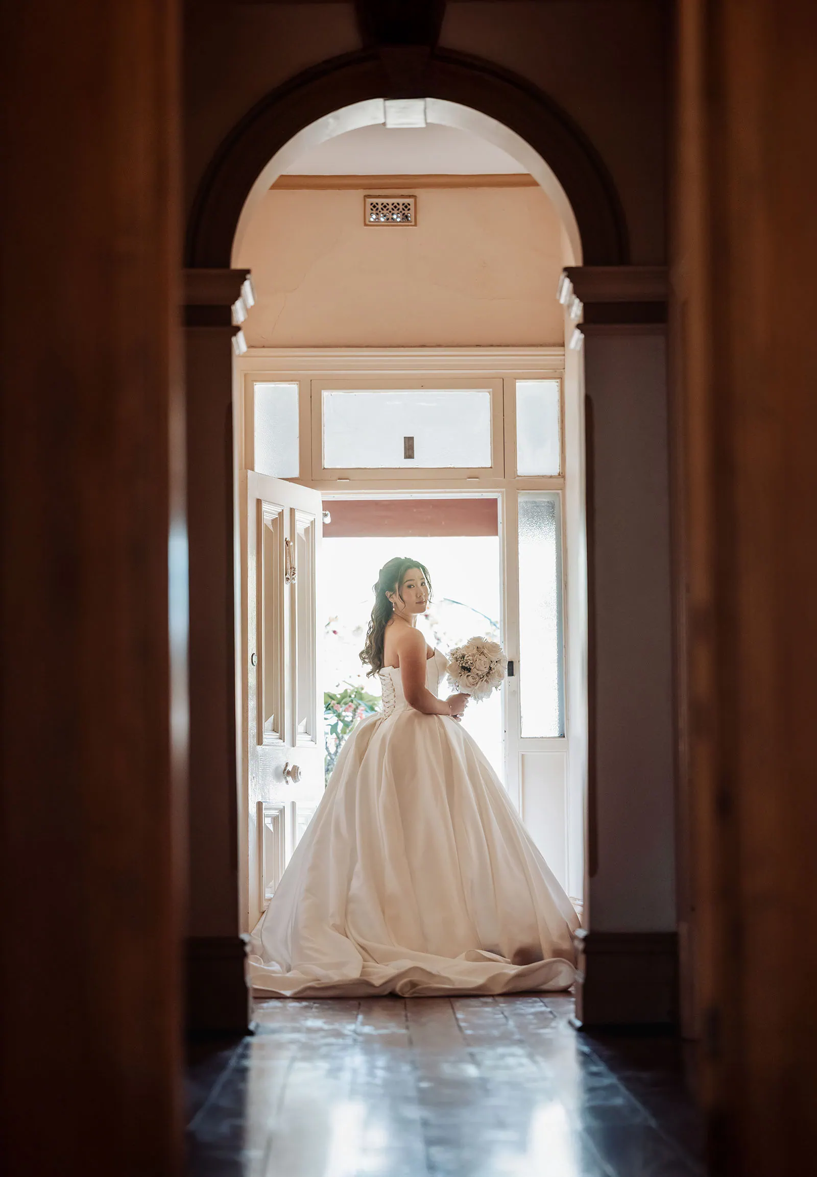 sunnybrae rose garden wedding - celina & anuj 12 Elegant wedding hallway with floral decor and soft lighting.