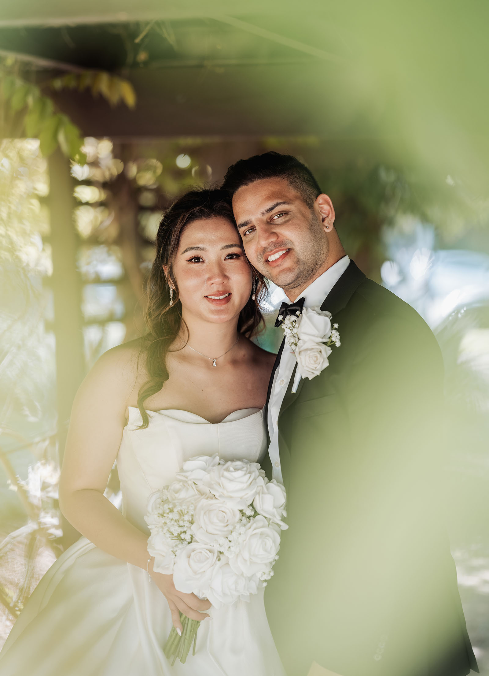 sunnybrae rose garden wedding - celina & anuj 65 Joyful bride and groom celebrating their wedding with laughter and happiness.