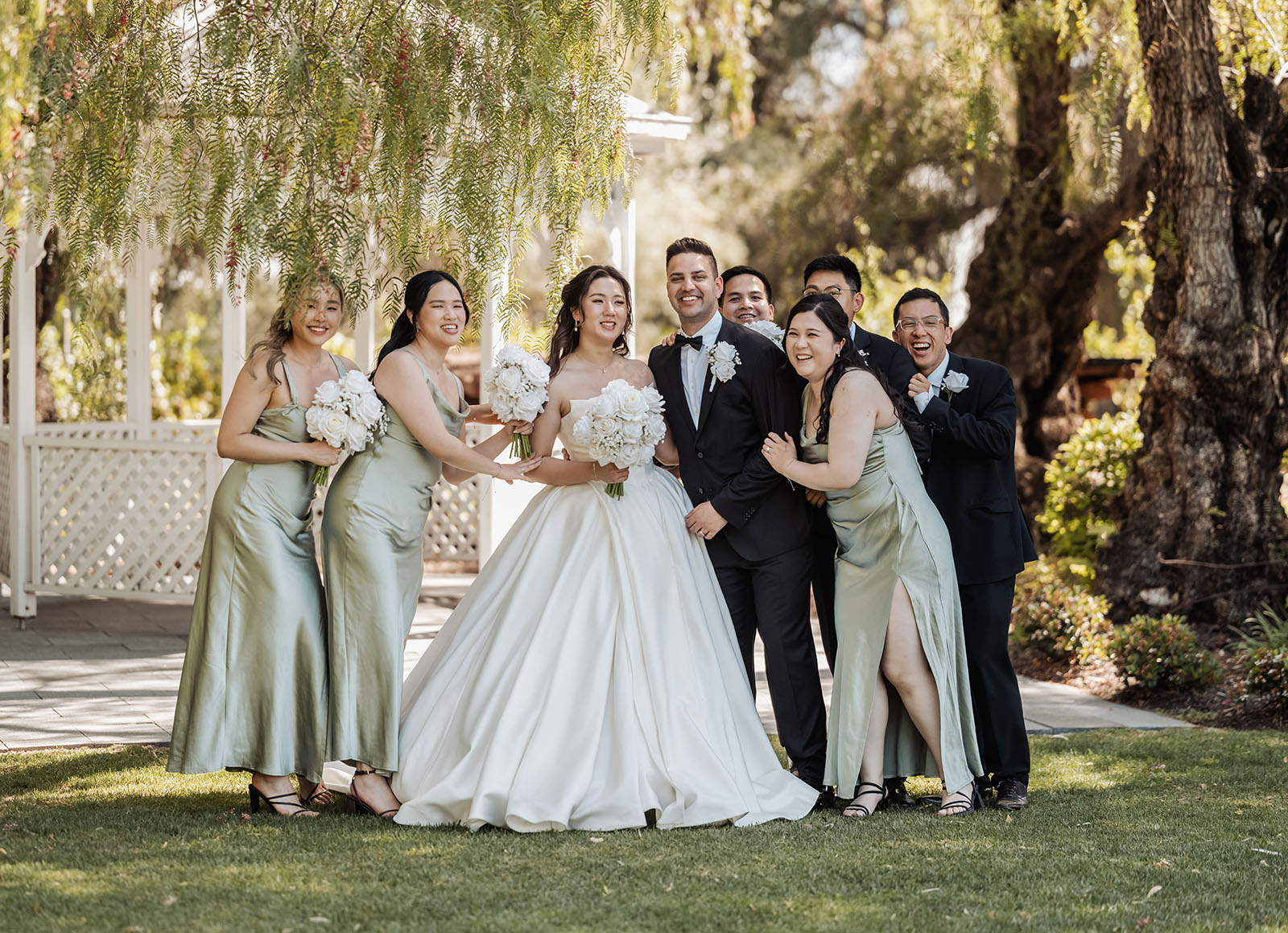 sunnybrae rose garden wedding - celina & anuj 56 Elegant outdoor wedding celebration with joyful guests and festive atmosphere.