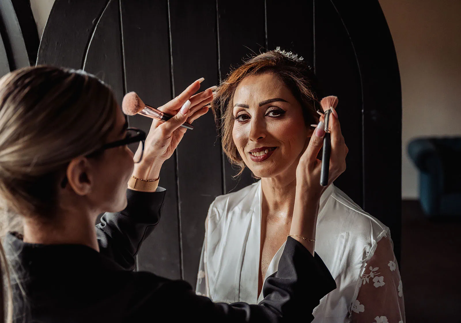 wedding at the manor in basket range - maryam & jason 120 Bride getting makeup done before wedding, beauty preparation scene.