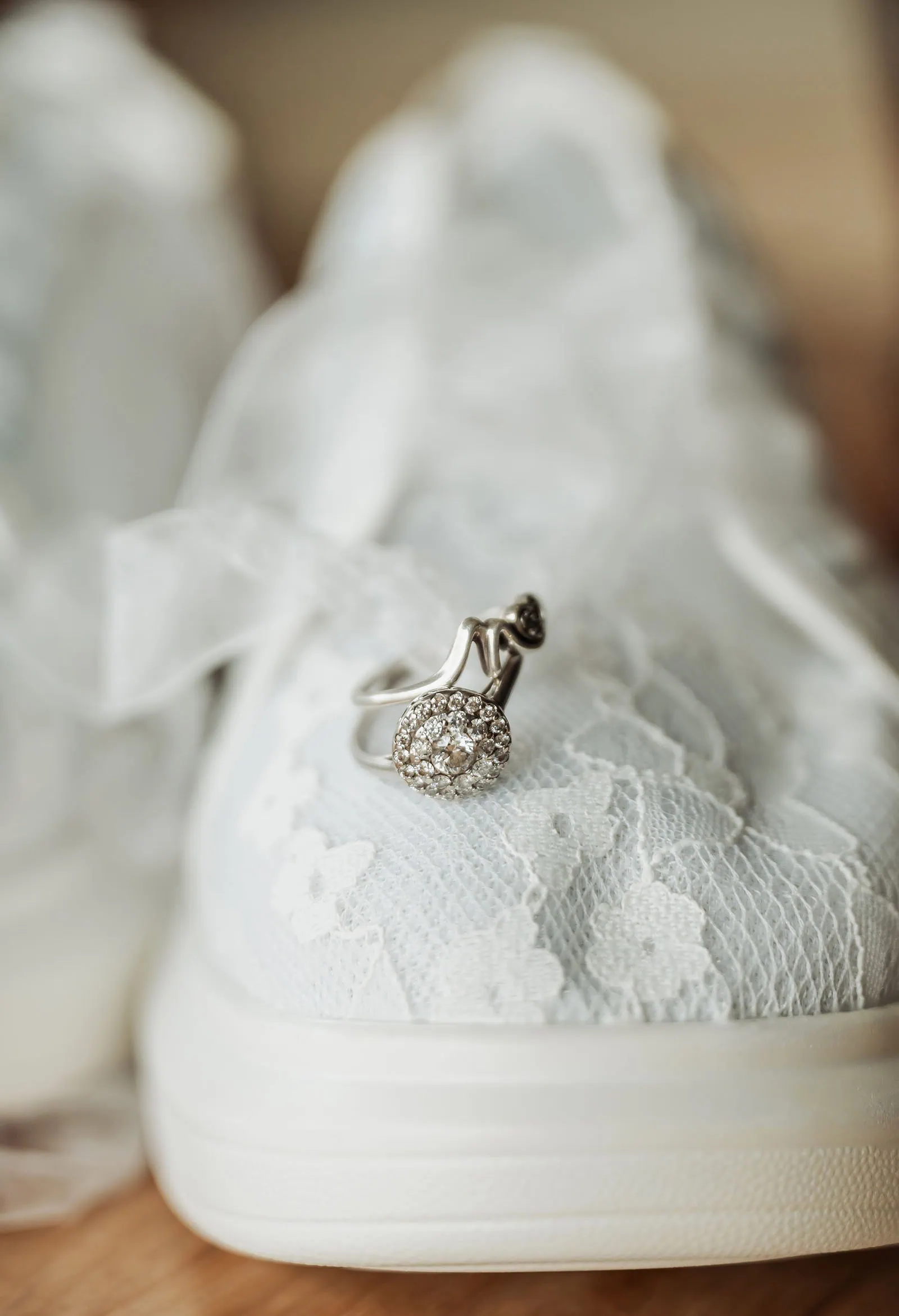 country victoria wedding in corrunnun – rachelle & anthony 292 Bridal sneaker with a ring, perfect for casual wedding chic.
