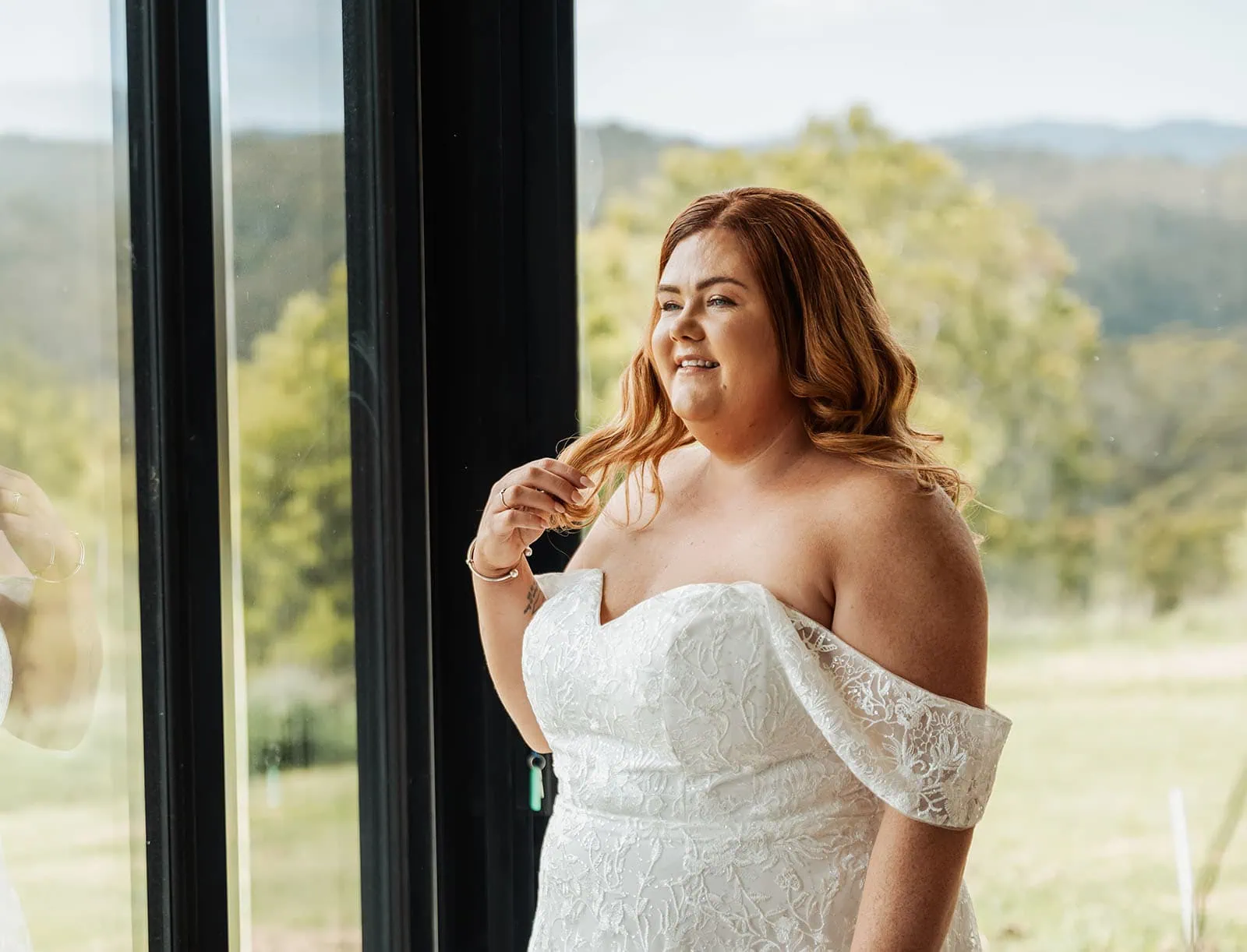 country victoria wedding in corrunnun – rachelle & anthony 305 Bride gazing out window in wedding dress, capturing serene elegance and anticipation.