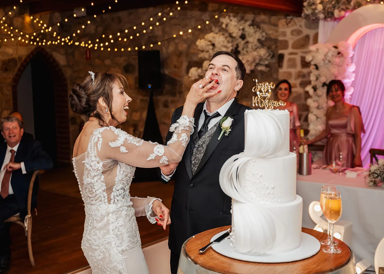 wedding at the manor in basket range - maryam & jason 166 Bride and groom cutting wedding cake at reception.