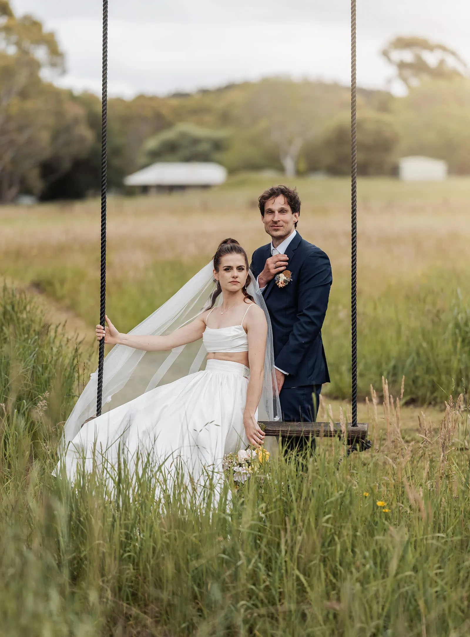 fleurieu cherries wedding - kimberley & richard 26 Bride and groom enjoying a romantic moment on a rustic swing.